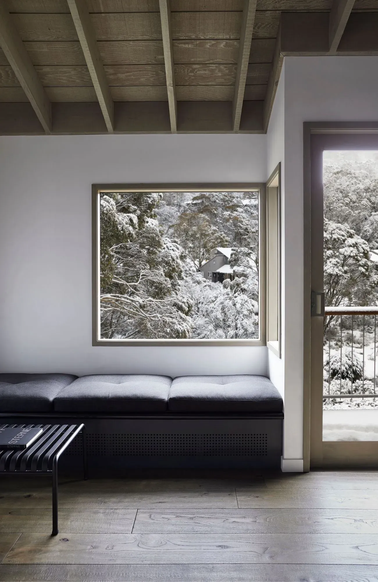 Cedar Cabin by Nicholas Gurney & Monique Easton. Snow board and framed mountain portrait.