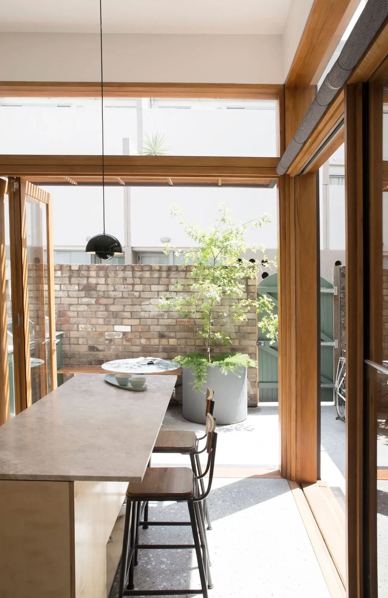 OTC Terrace House by Marker Architecture & Design courtyard and kitchen view