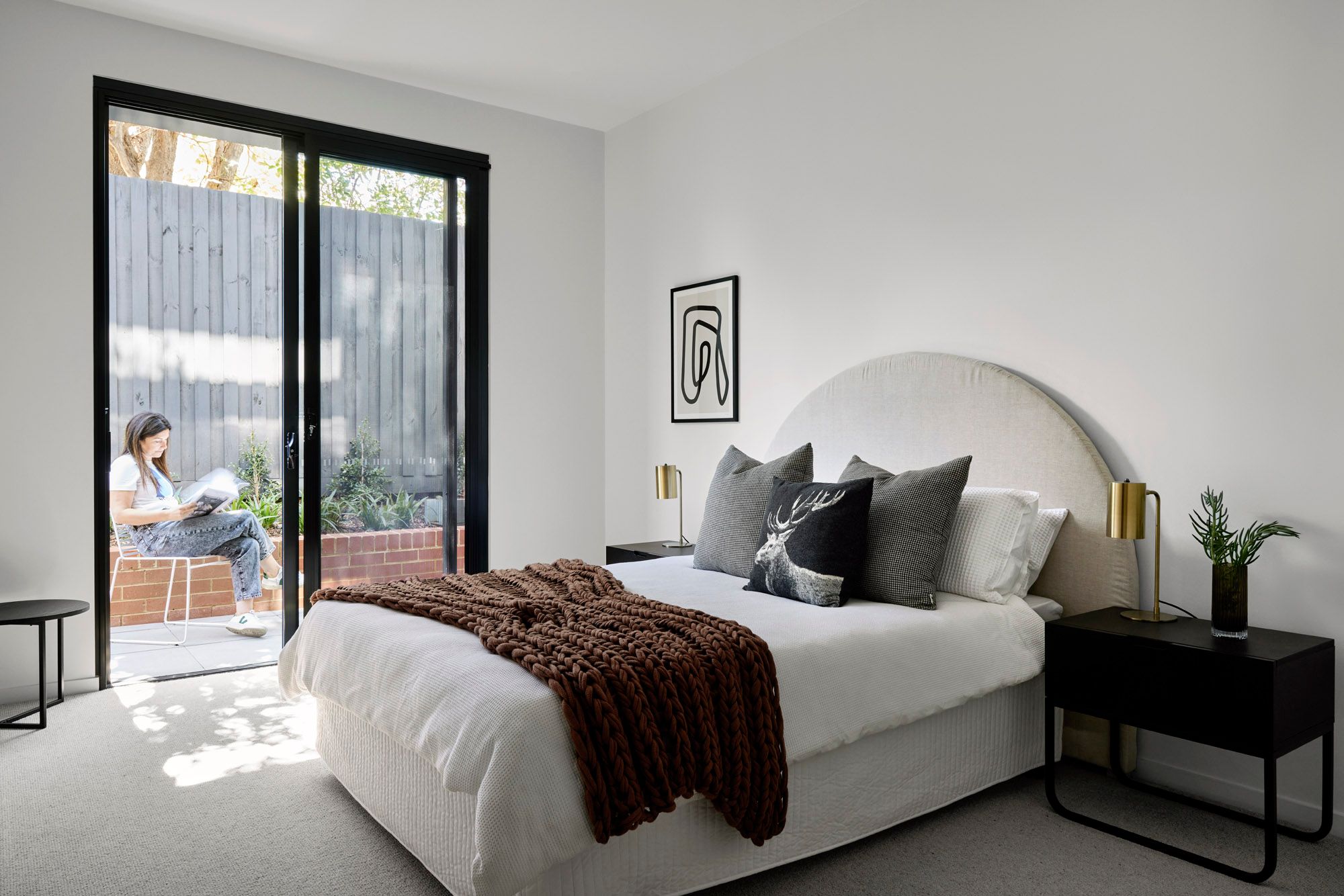 Slate House by Austin Maynard Architects. Master bedroom view, with connecting courtyard terrace