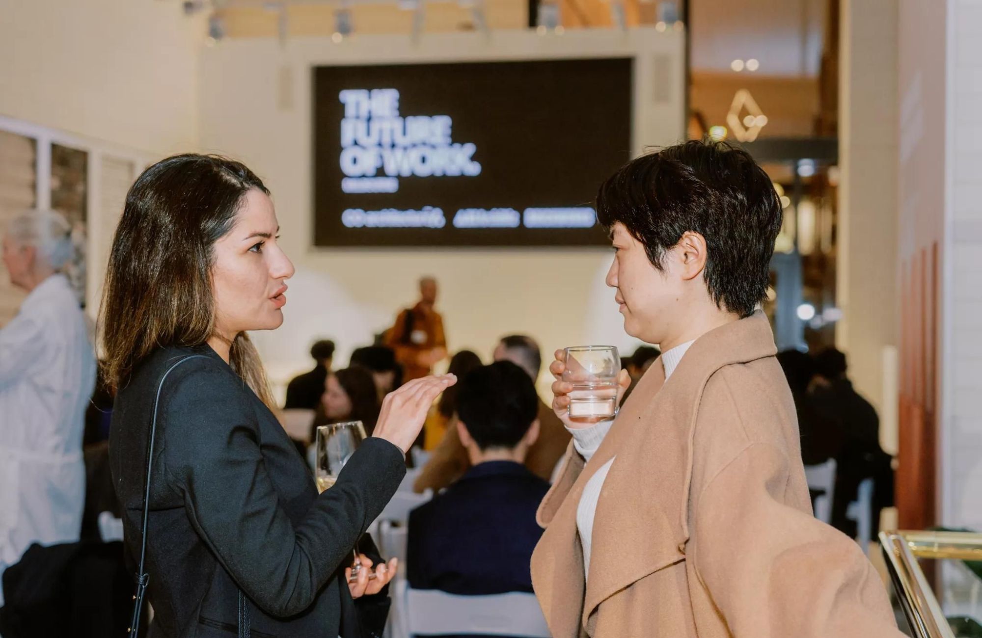 CO-architecture I The Future of Work Melbourne. Two people networking