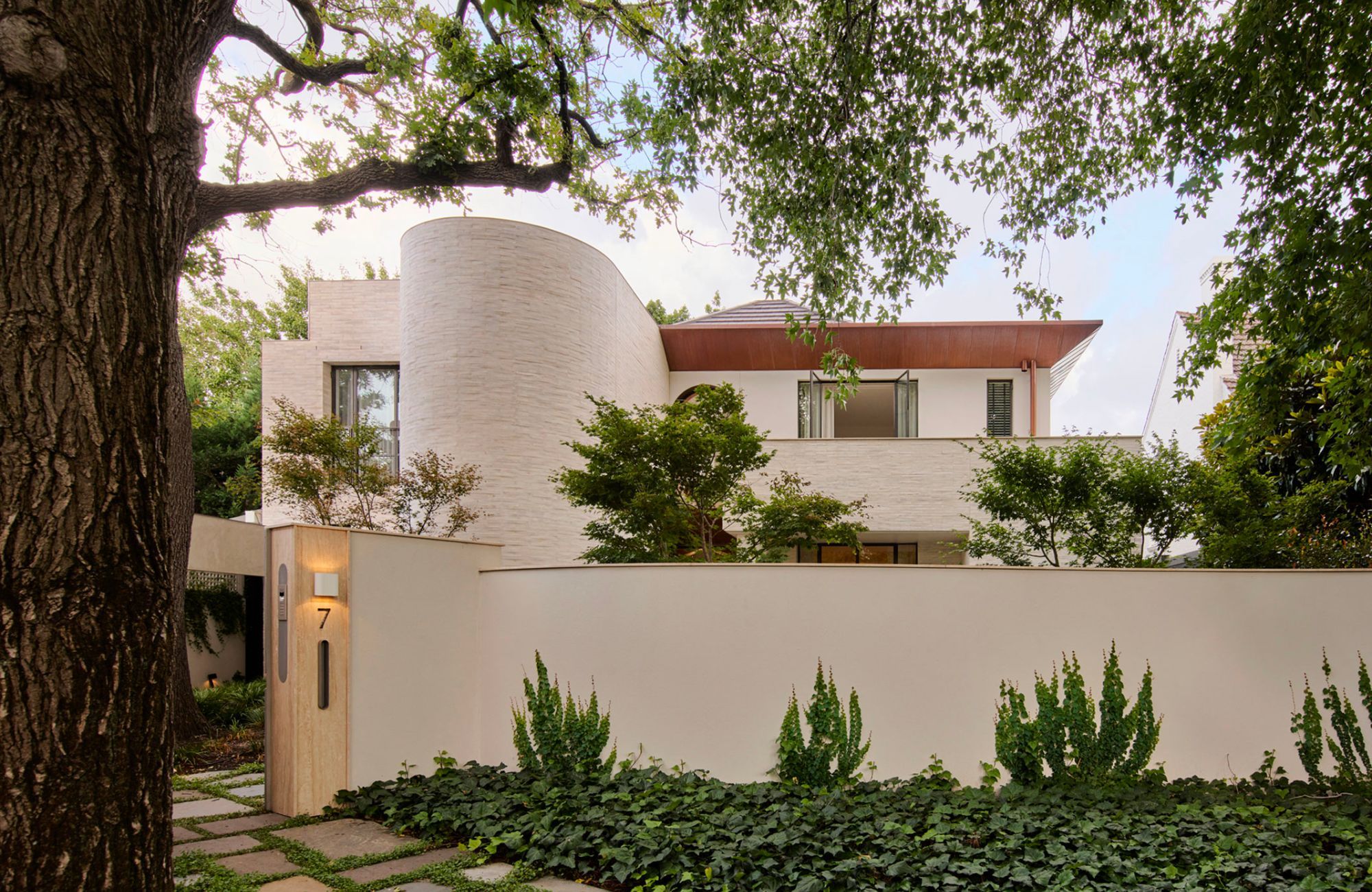 Toorak II House by KPDO showing external facade and front fence