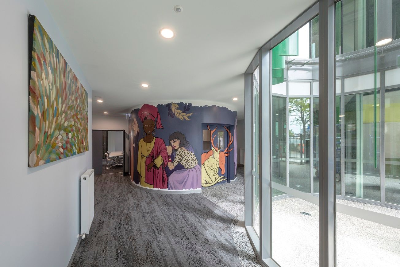 Mcauly Community services for Women by Bickerton Master. View into Mcauly centre, showcaing mural
