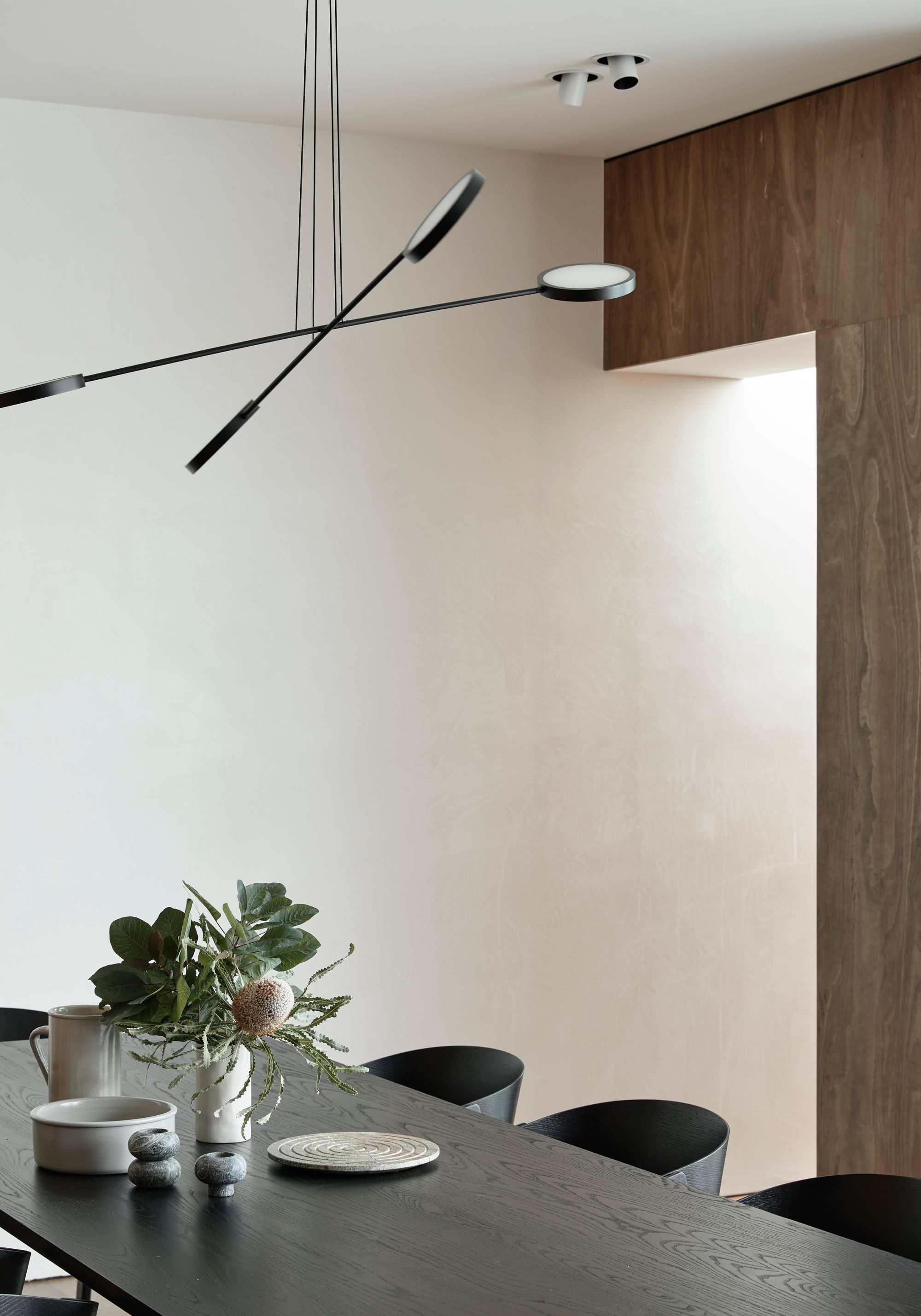 Carlton North Residence by Project 12 Architecture. Detailed view of kitchen featuring six seater Dining table from Cult