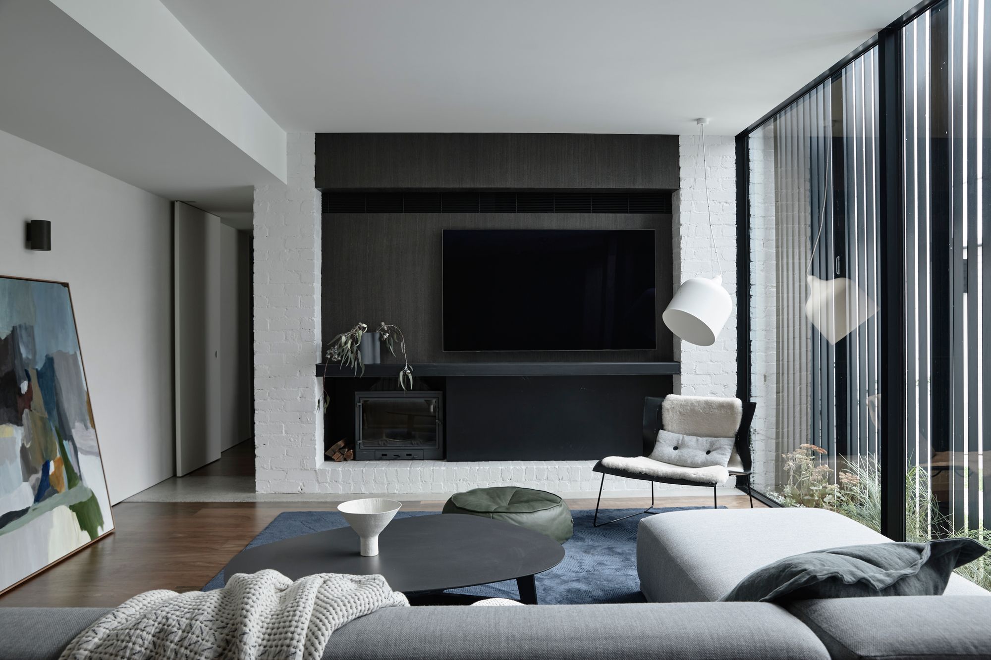 Carlton North Residence by Project 12 Architecture. Living room, featuring living edge furniture, Jardan Decor, studio gallery artwork and a Halcyon lake rug.  