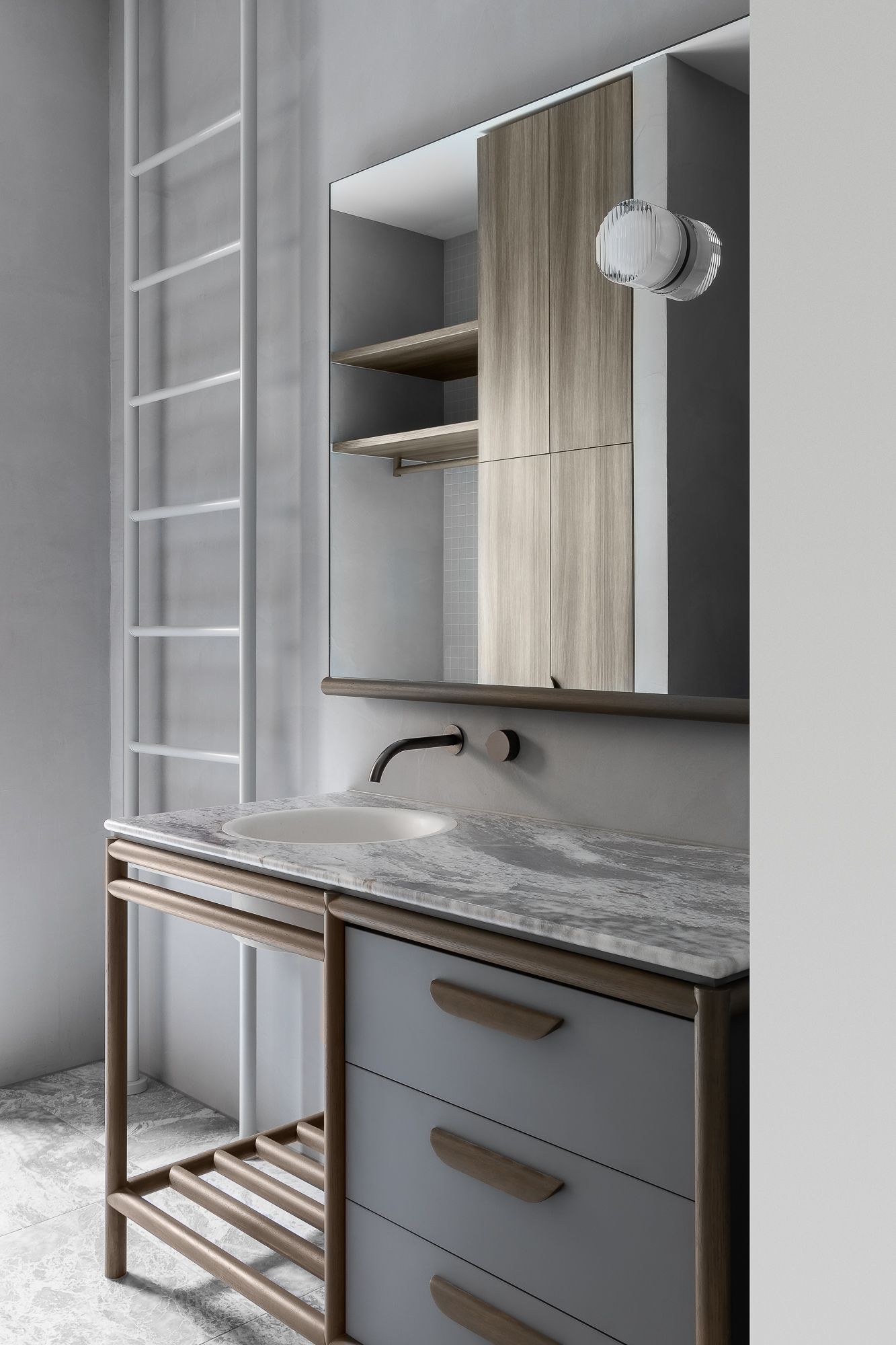 Ripponlea House by Luke Fry Architecture and Interior Design. Side view of bathroom vanity featuring  European oak, natural stone, concrete material palette. 