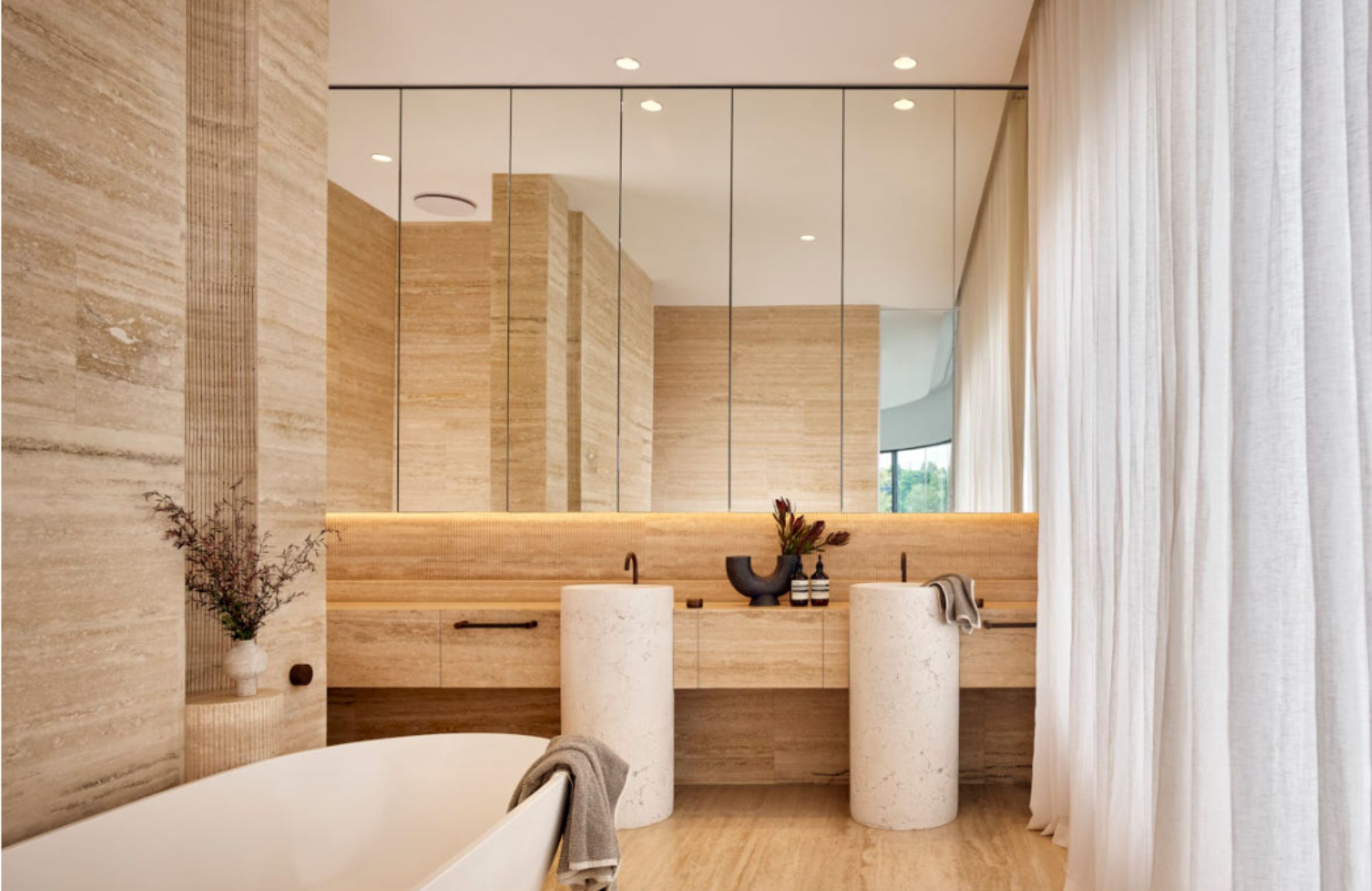 Larc Hamilton by Studio Collective. Bathroom with feature travertine stone