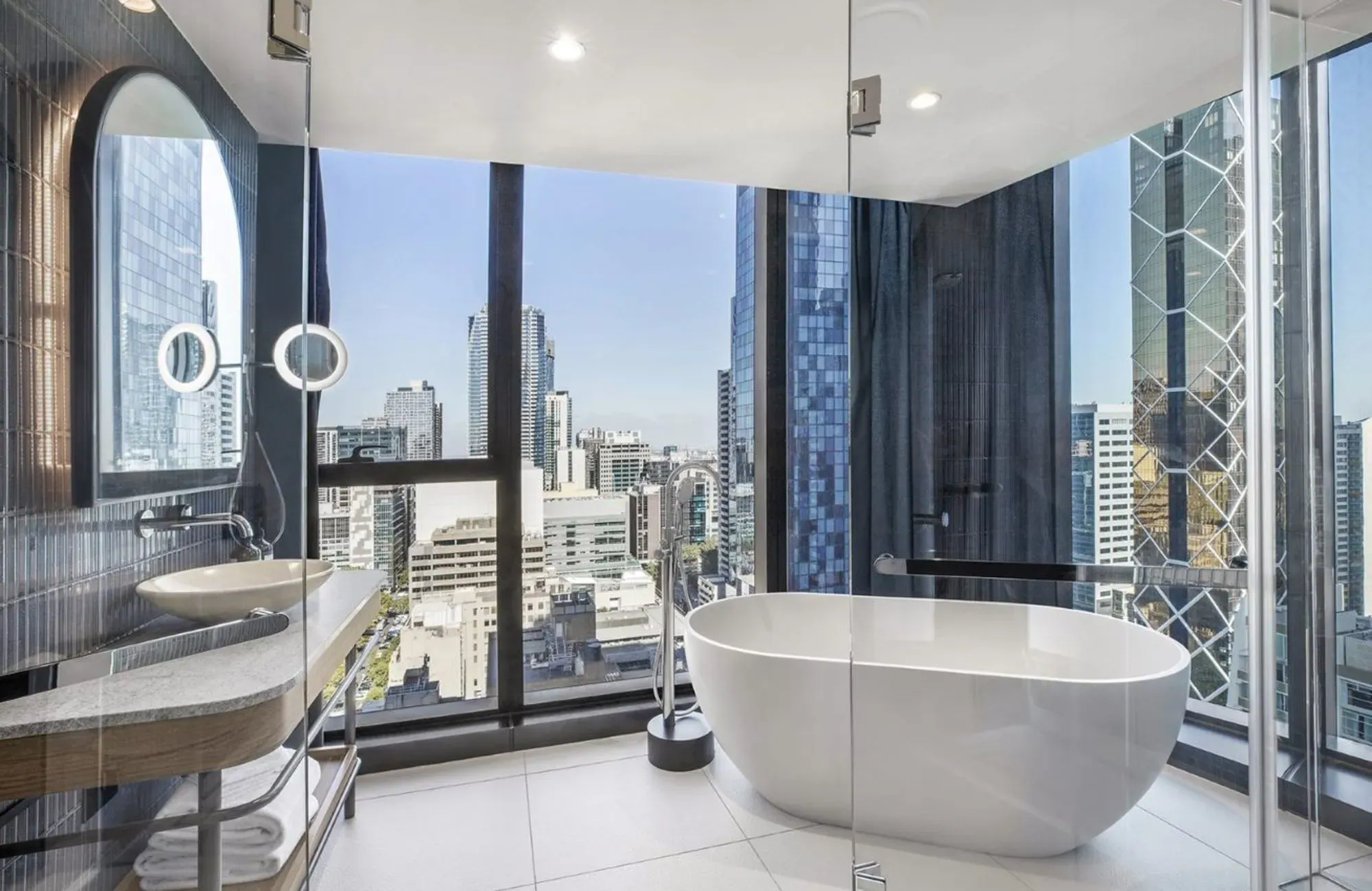 Voco Melbourne Central by IHG Hotels & Resorts. Guest bathroom, featuring large bathtub. 