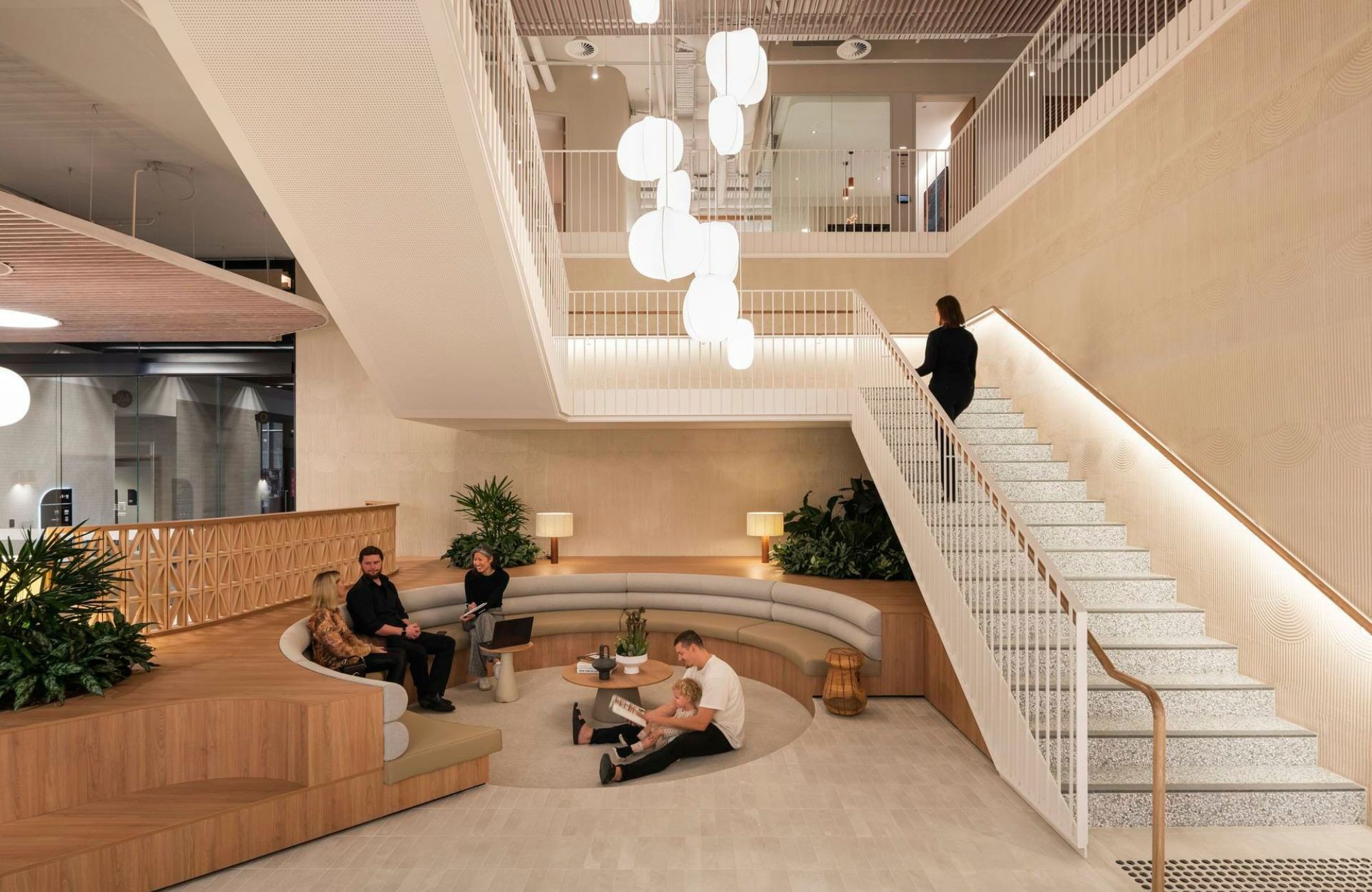 ABN Group HQ by Woods Bagot. Communal seating area, featuring steps to next floor
