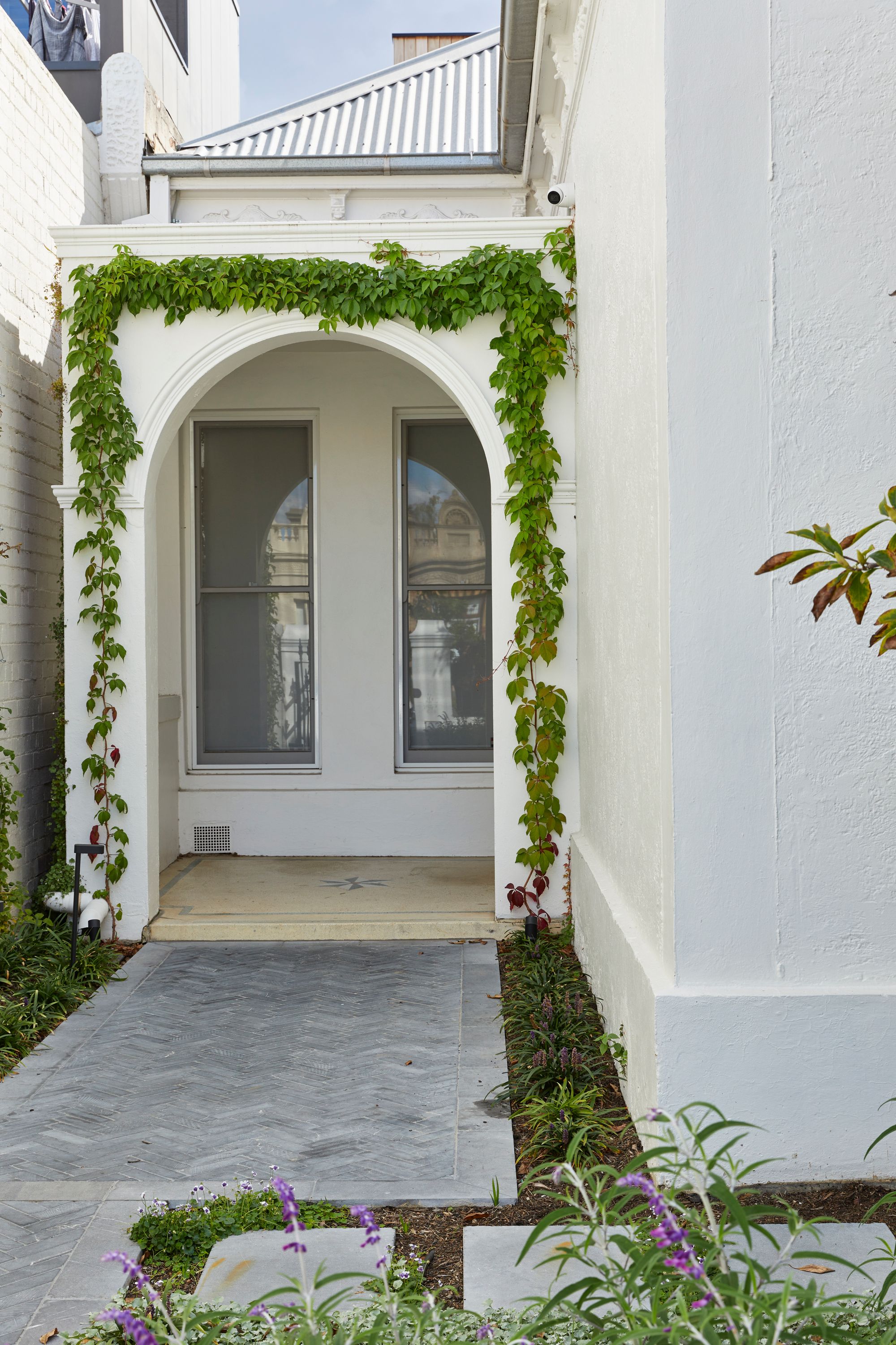 Carlton North Residence by Project 12 Architecture. Facade entrance, featuring characteristics of traditional Victorian style cottage 