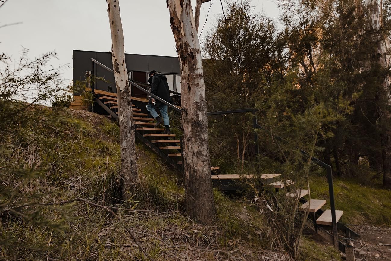 Cortes Cabin by Cortes Stays. Cabin steps leading to edge of Ovens River