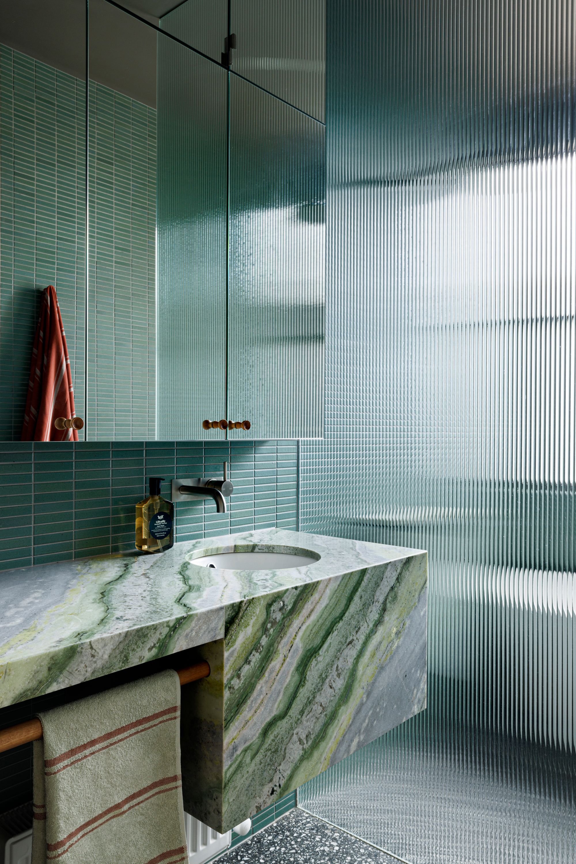 First Blush by Smac Studio. Green themed bathroom featuring fluted shower screen. 
