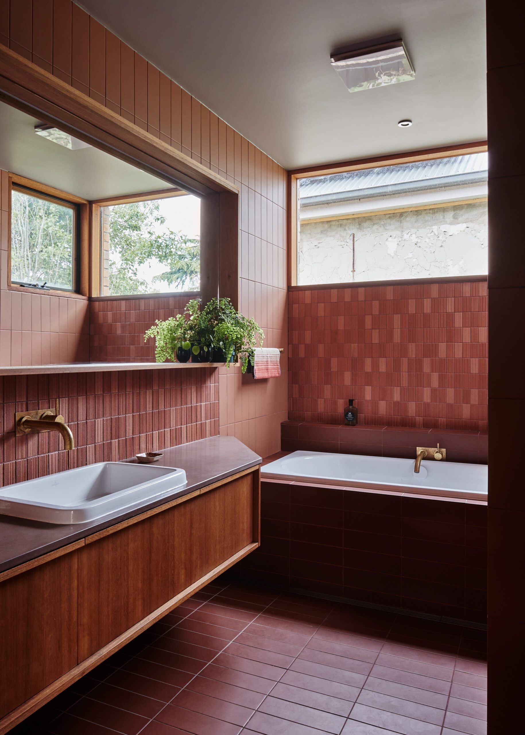 West Bend House by MRTN Architects. Rustic farmhouse bathroom mixed with 70's refinement 