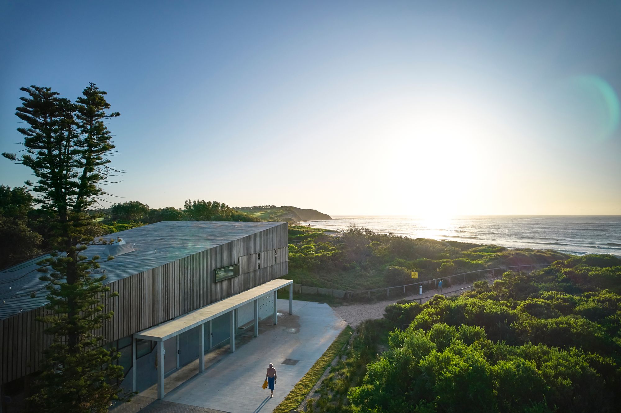 Long Reef SLSC by Adriano Pupilli Architects showing building in the coastal landscape