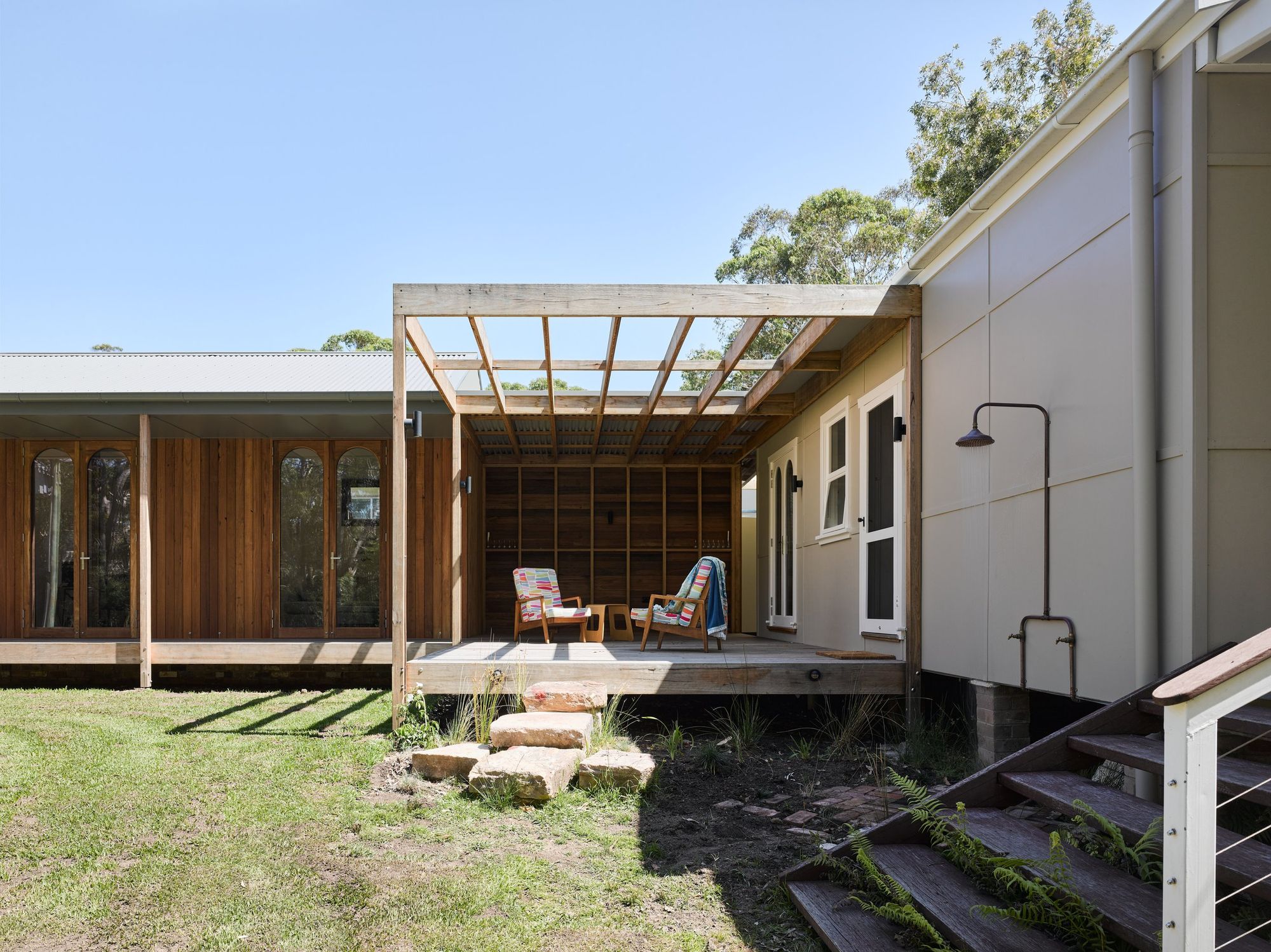 Re-Generation House by Alexander Symes Architect showing timber deck and outdoor shower