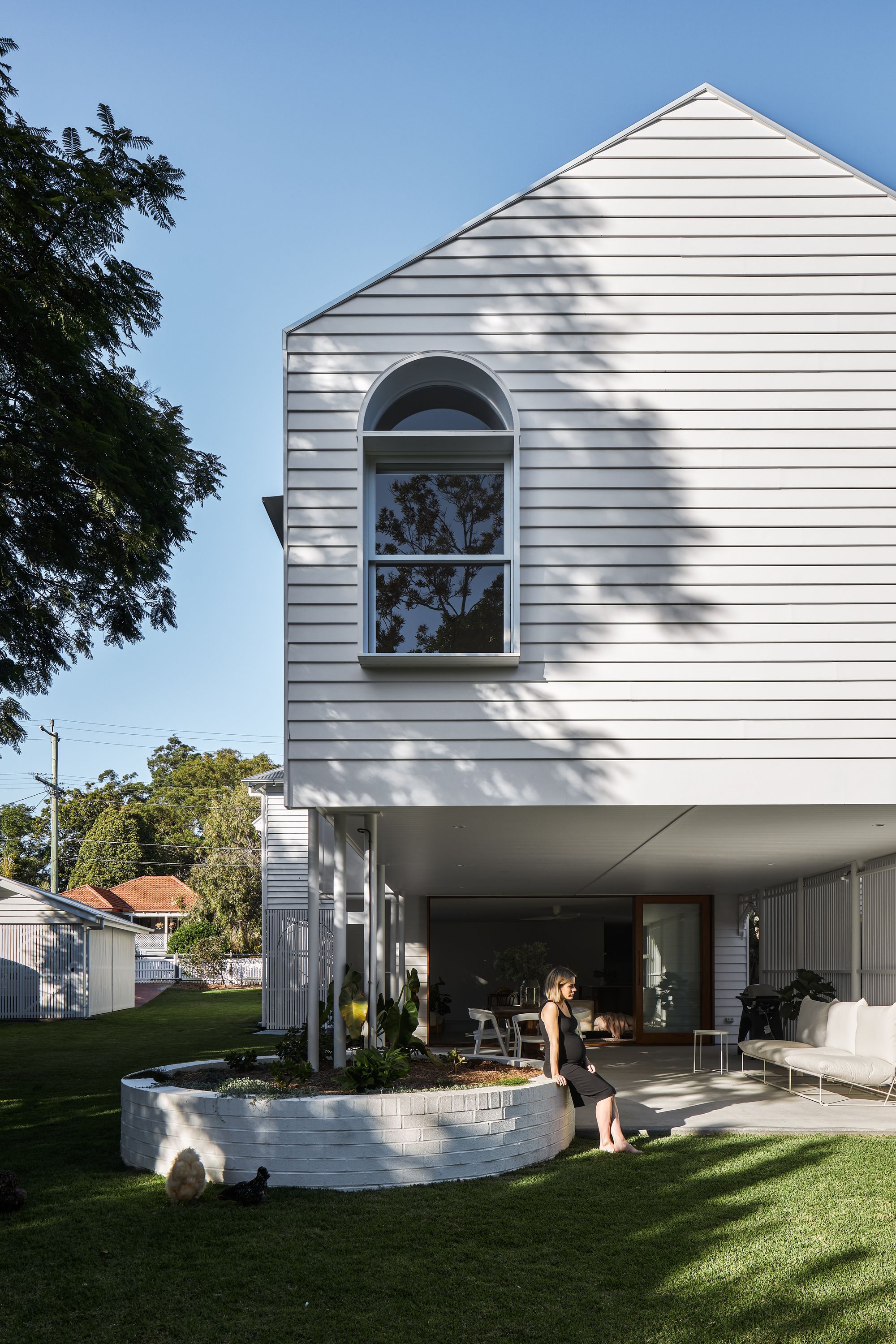 Fuller Street Cottage by DAH Architecture showing rear weatherboard facade