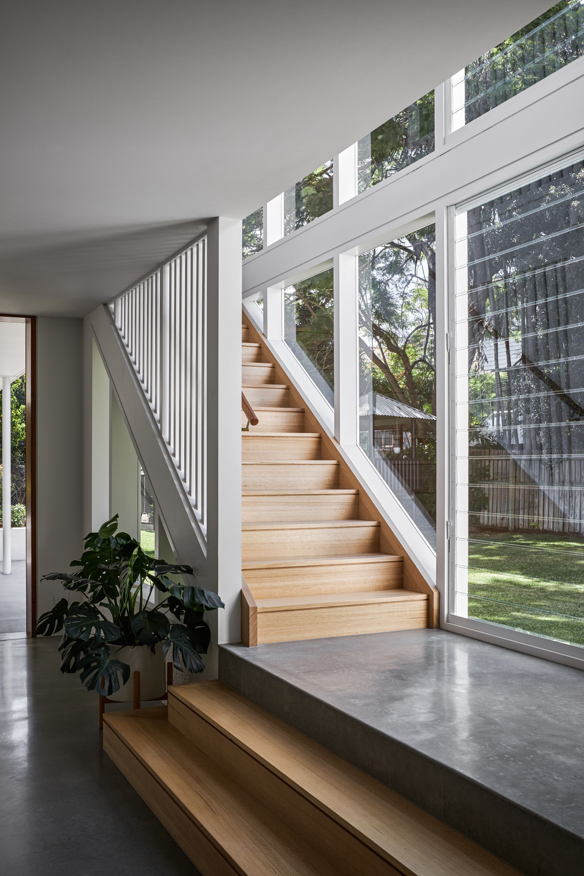 Fuller Street Cottage by DAH Architecture showing internal timber and concrete staircase