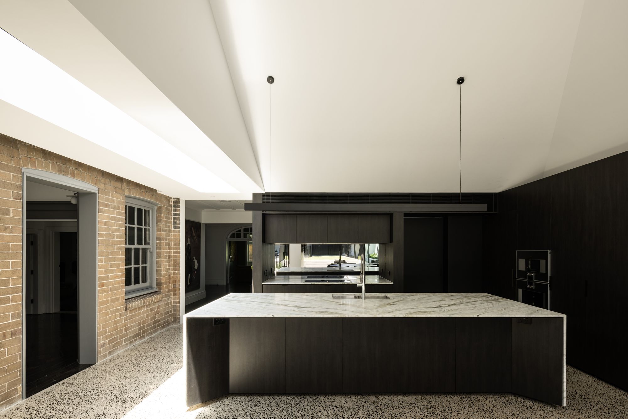 Tongkah by MCK Architects. Contemporary kitchen, featuring elements that pay tribute to the heritage features shown in the original dwelling. 