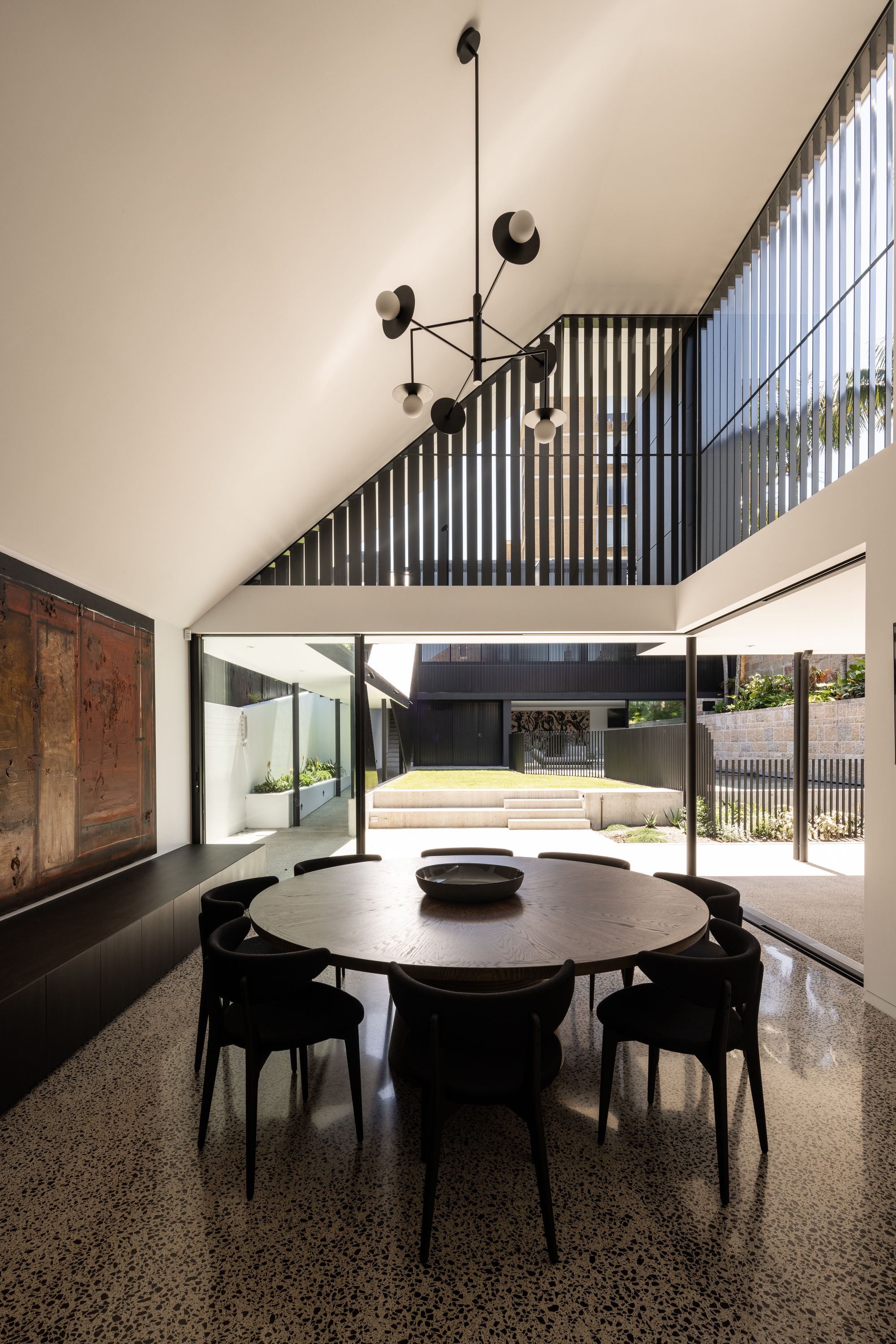 Tongkah by MCK Architects. Dining room view opening out onto connected outdoor area. 