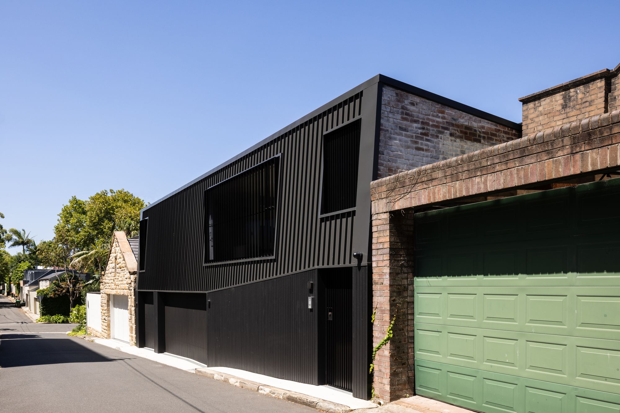 Tongkah by MCK Architects. New rear extension view from alley way.