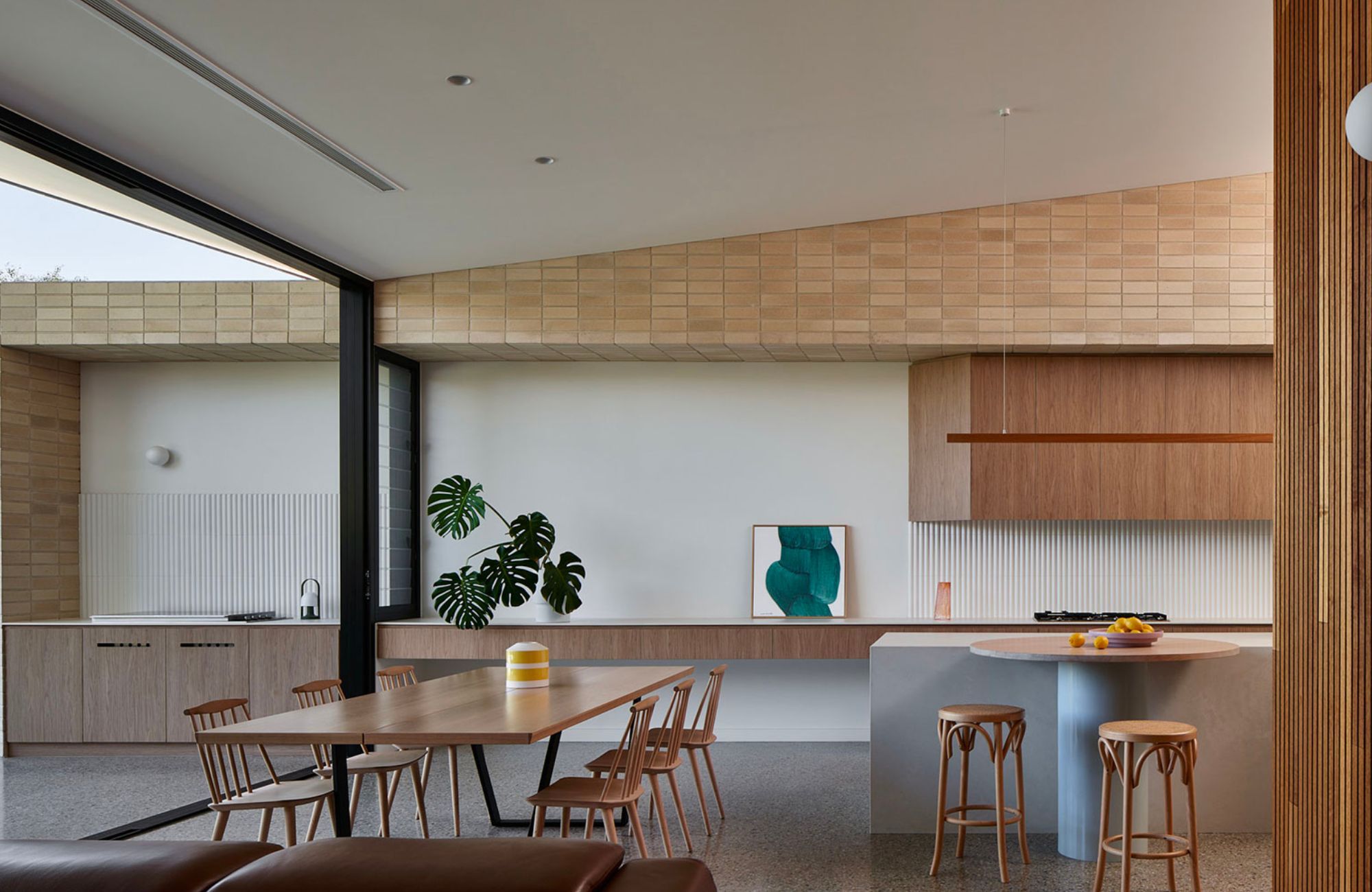 Swoosh House by Das Studio showing interior of kitchen and dining space