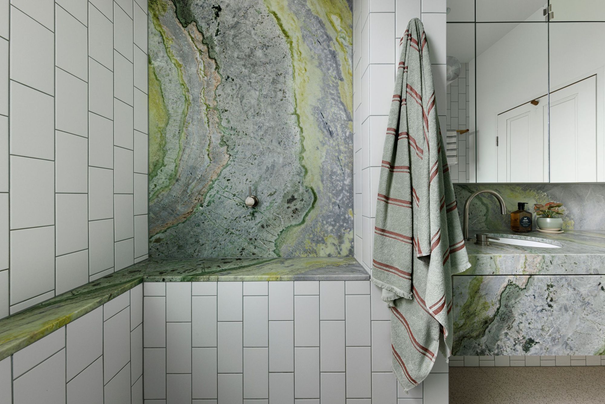 Tiara House by FMD Architects. Bathroom, featuring chartreuse and green veined stone finishes 