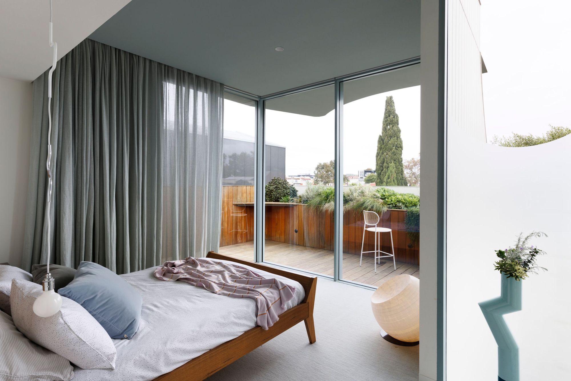 Tiara House by FMD Architects. Master bedroom suite with view out to deck