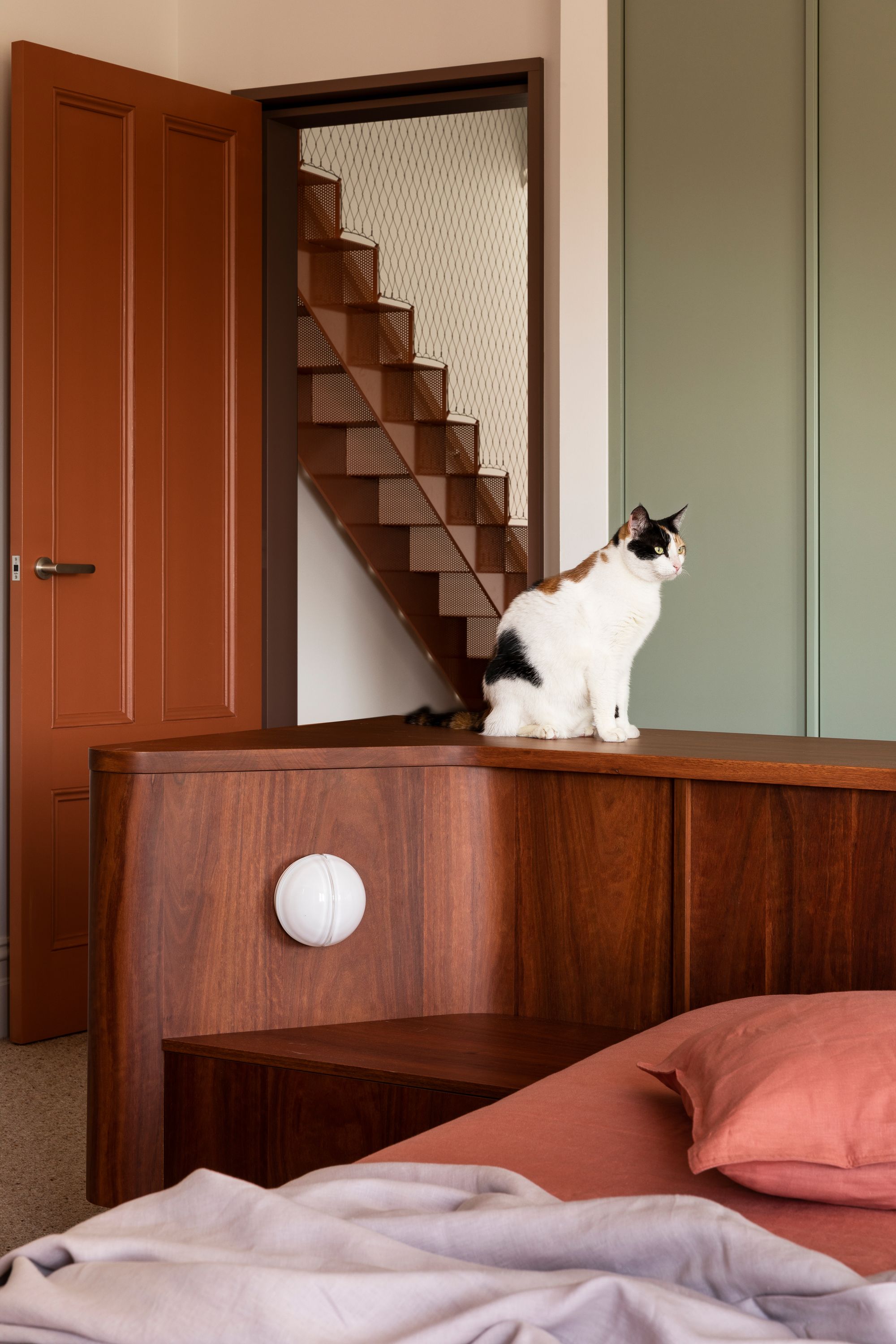 Hermon by WOWOWA. Master bedroom suite, cat posed on bed board