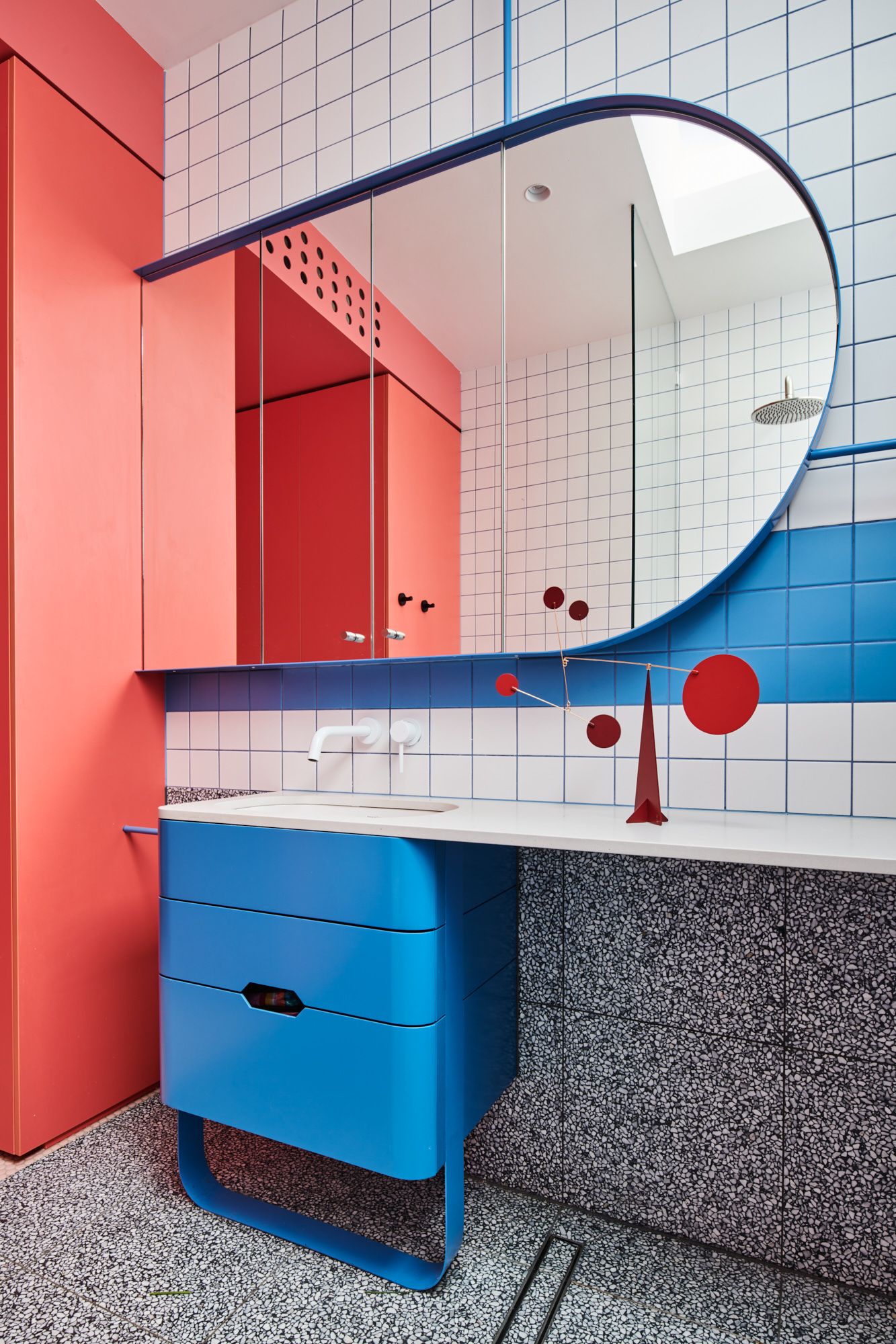 Hot Top Peak by FIGR Architecture. Bathroom viewing, featuring vibrant shades of blue and salmon. 