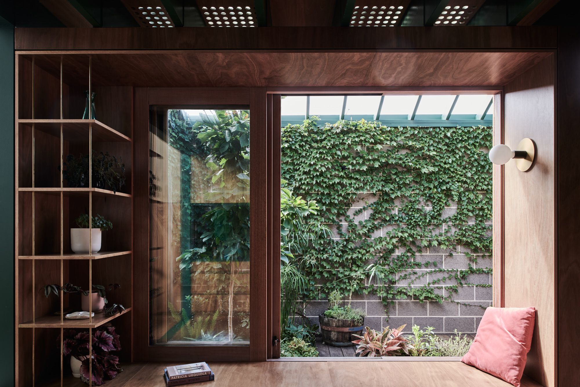 Hot Top Peak by FIGR Architecture. Seating/reading nook, windows open out to courtyard.