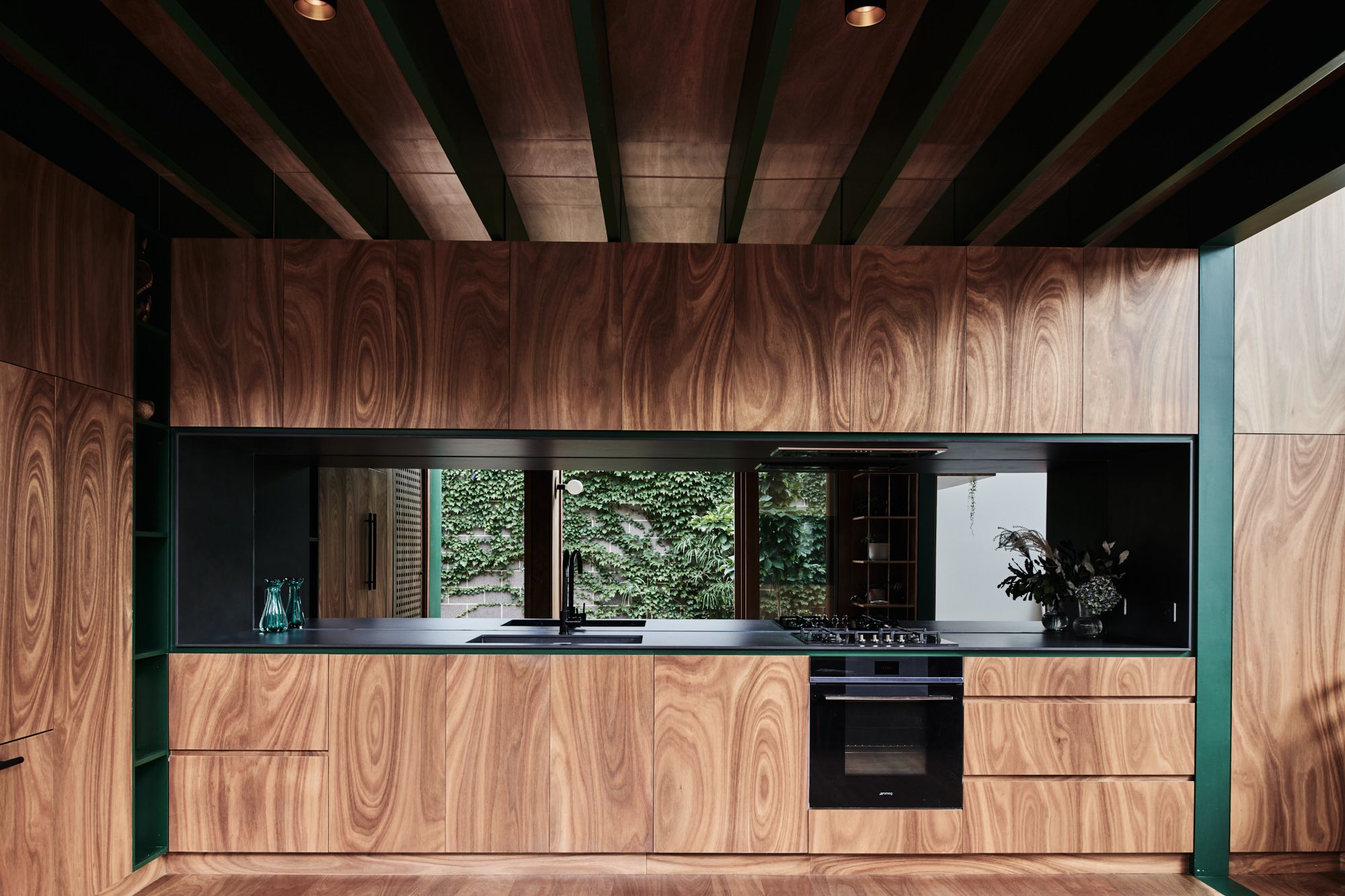 Hot Top Peak by FIGR Architecture. Kitchen area adorned with spotted gum plywood.
