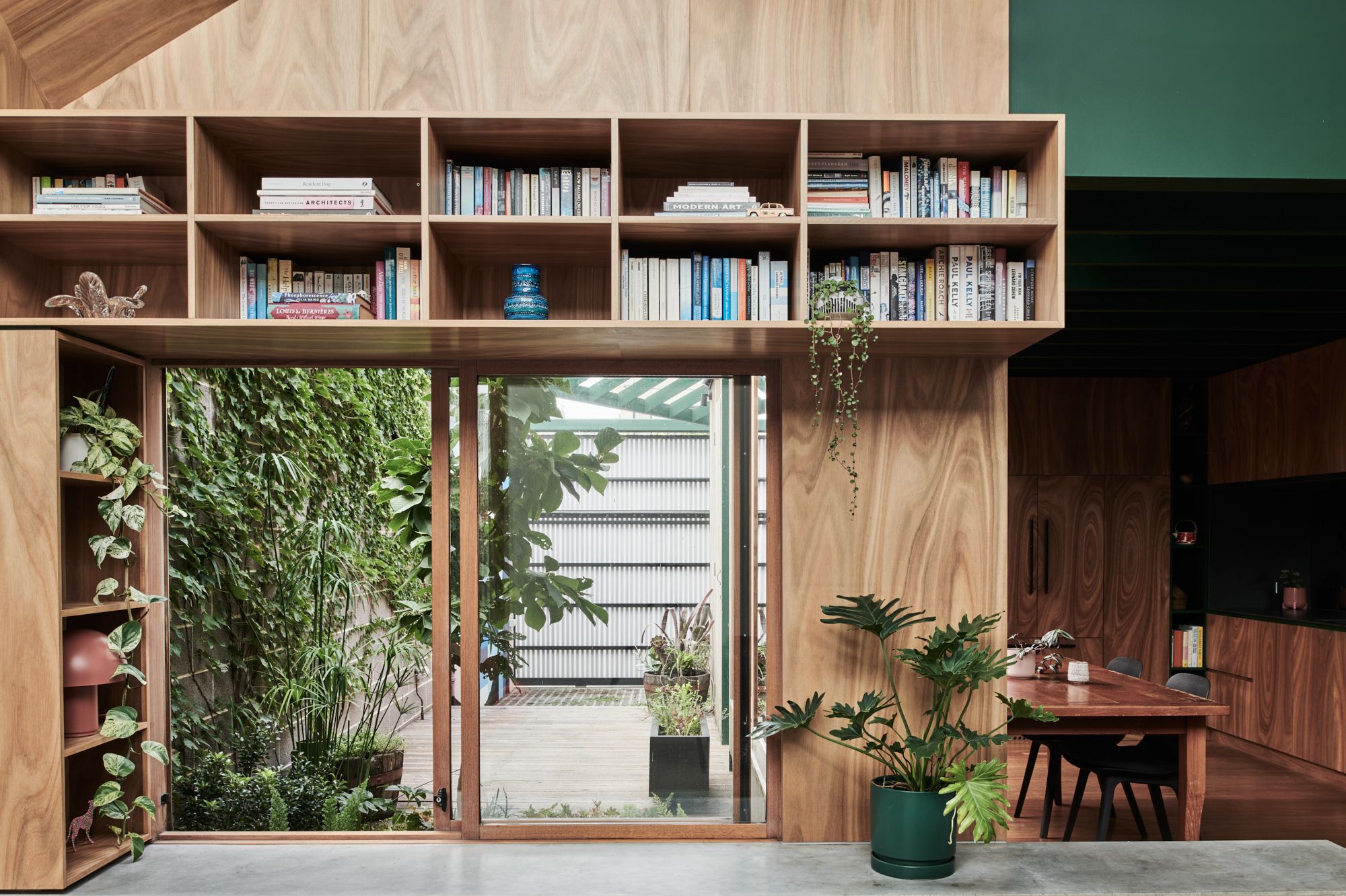 Hot Top Peak by FIGR Architecture. Detailed view of kitchen, dining and bookshelf. 
