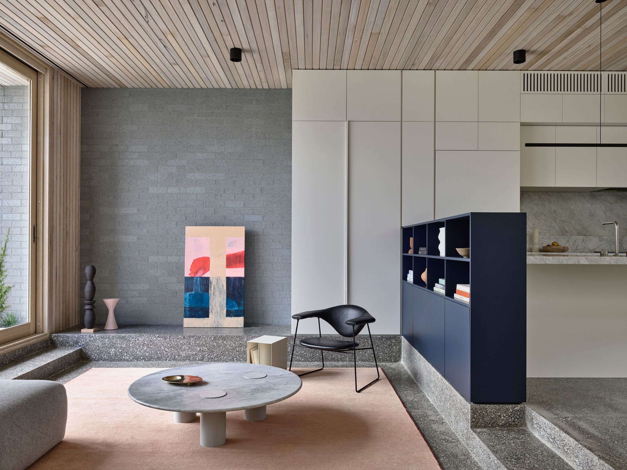 Silvertop House by Tom Robertson Architects. Sunken living room next to kitchen