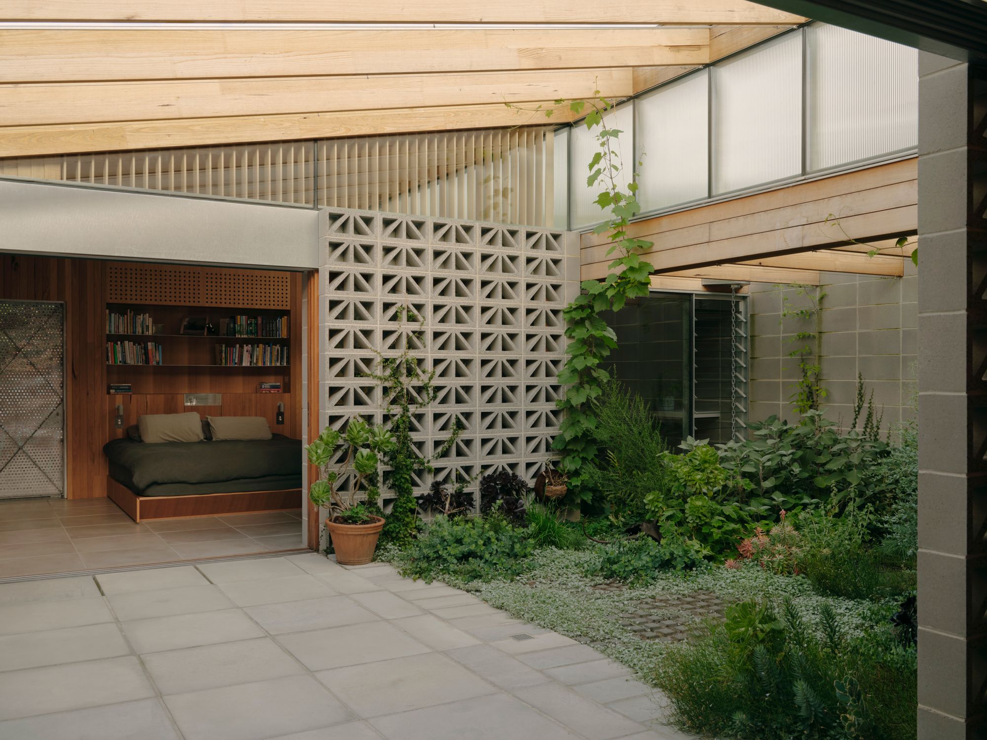 Sunday by Architecture architecture. Courtyard area, with master bedroom suite opening up and out to courtyard. 