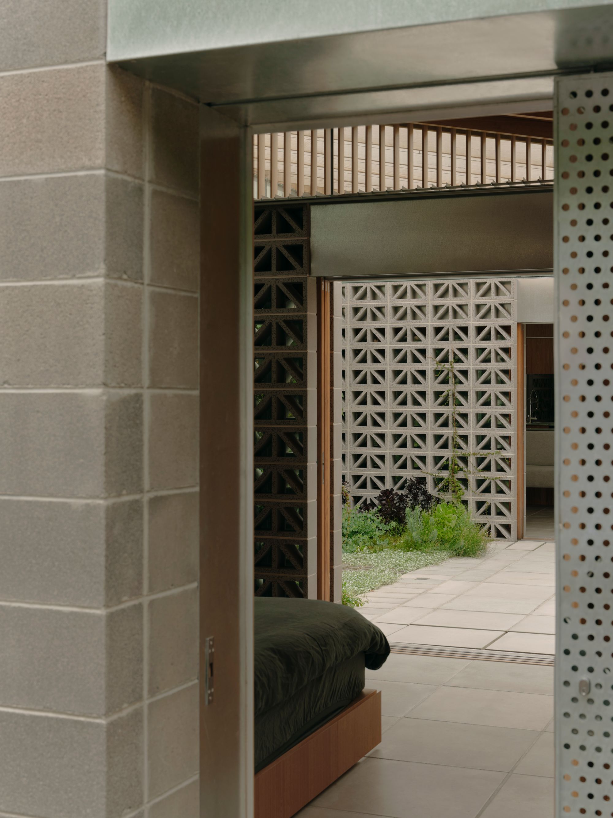 Sunday by Architecture architecture. View into master bedroom and then out to courtyard. 