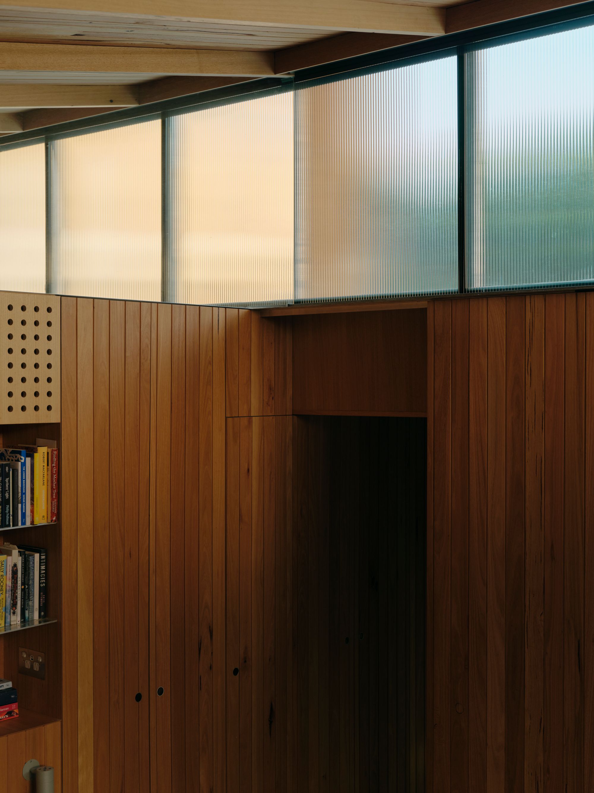 Sunday by Architecture architecture. Detailed view of living room and booking shelf. 