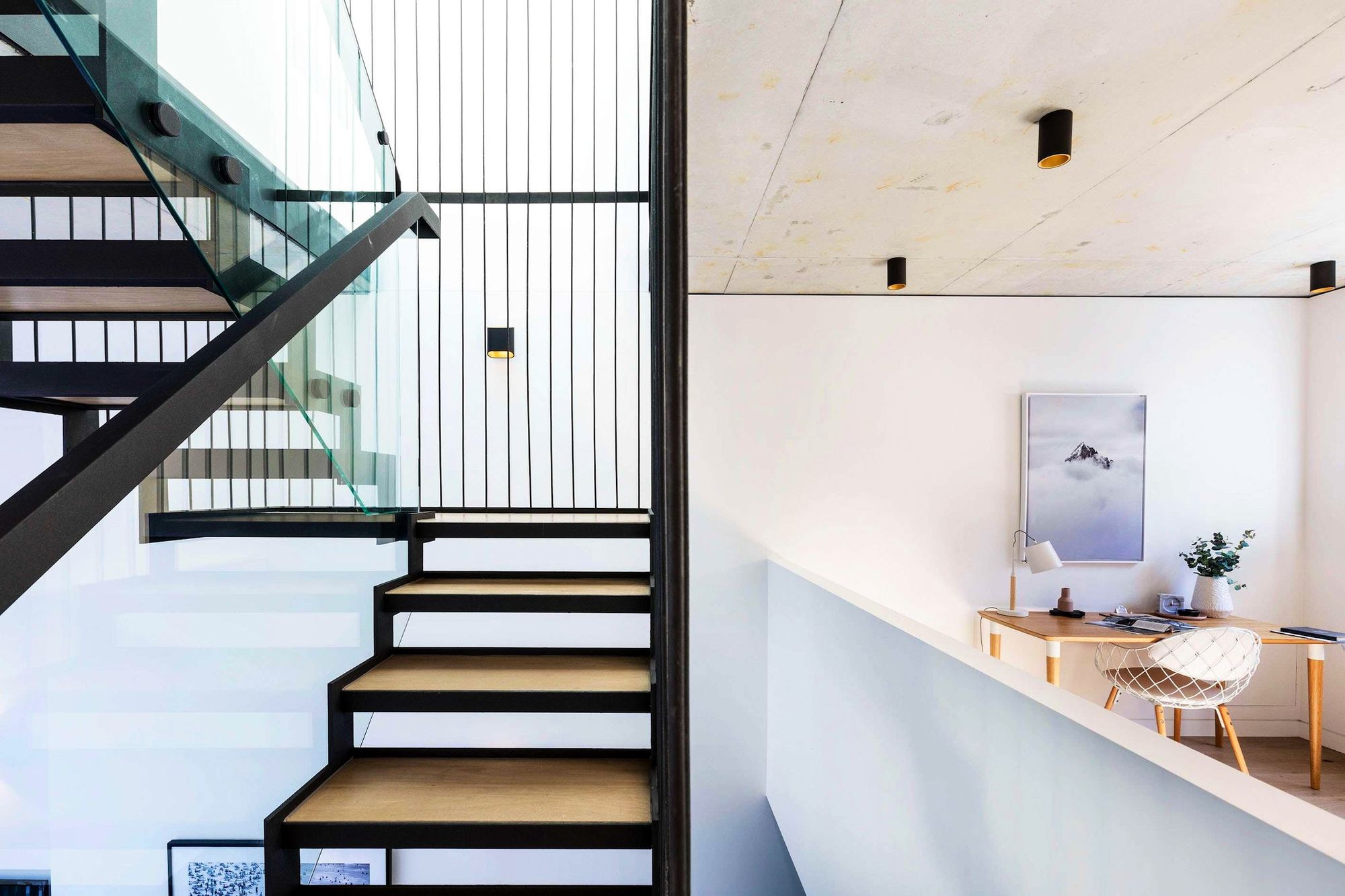 Darlinghurst Residence by JKMarchitects showing void space and feature staircase