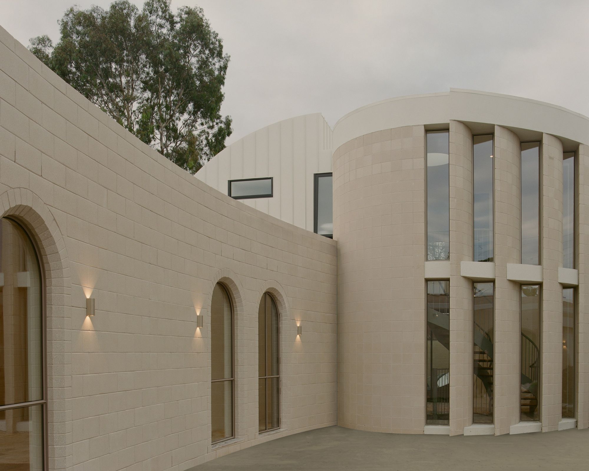 Northcote Hacienda by Hindley & Co. Northcote Hacienda project, façade view featuring blush curvature form