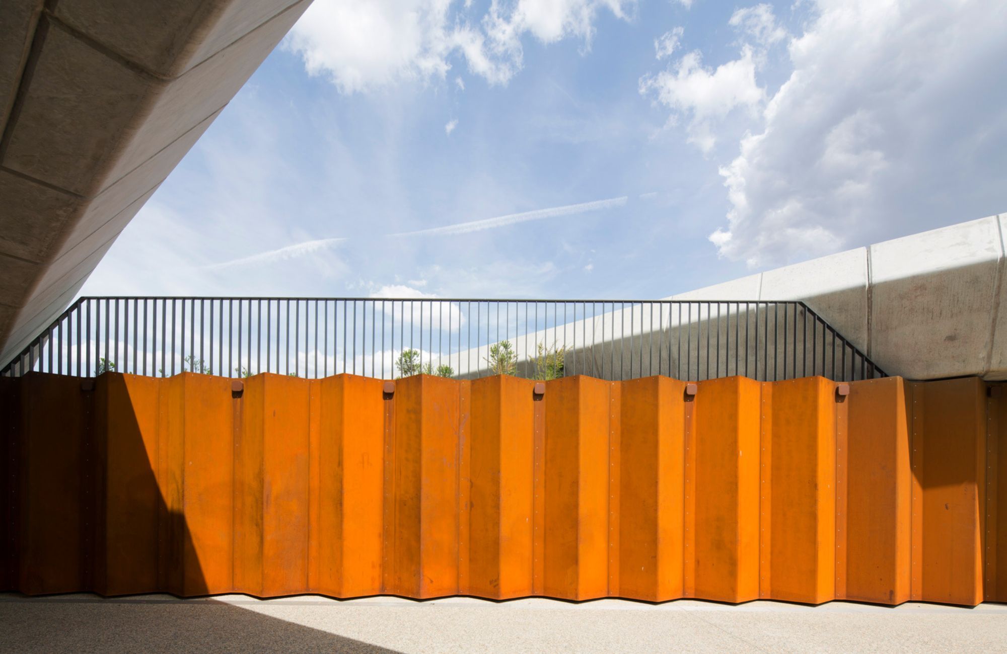 Bowen Place Crossing by Lahznimmo showing corten wall