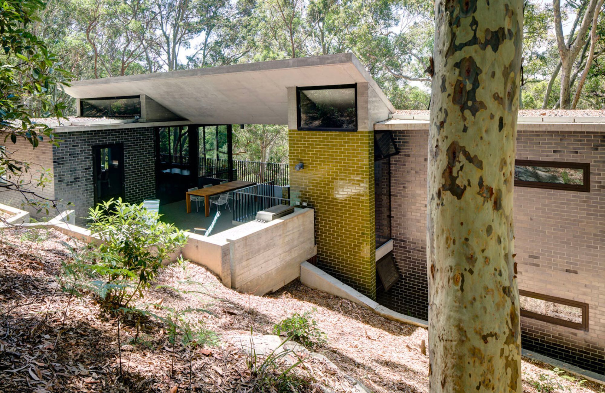 Pretty Beach House by Lahznimmo showing house in bushland setting