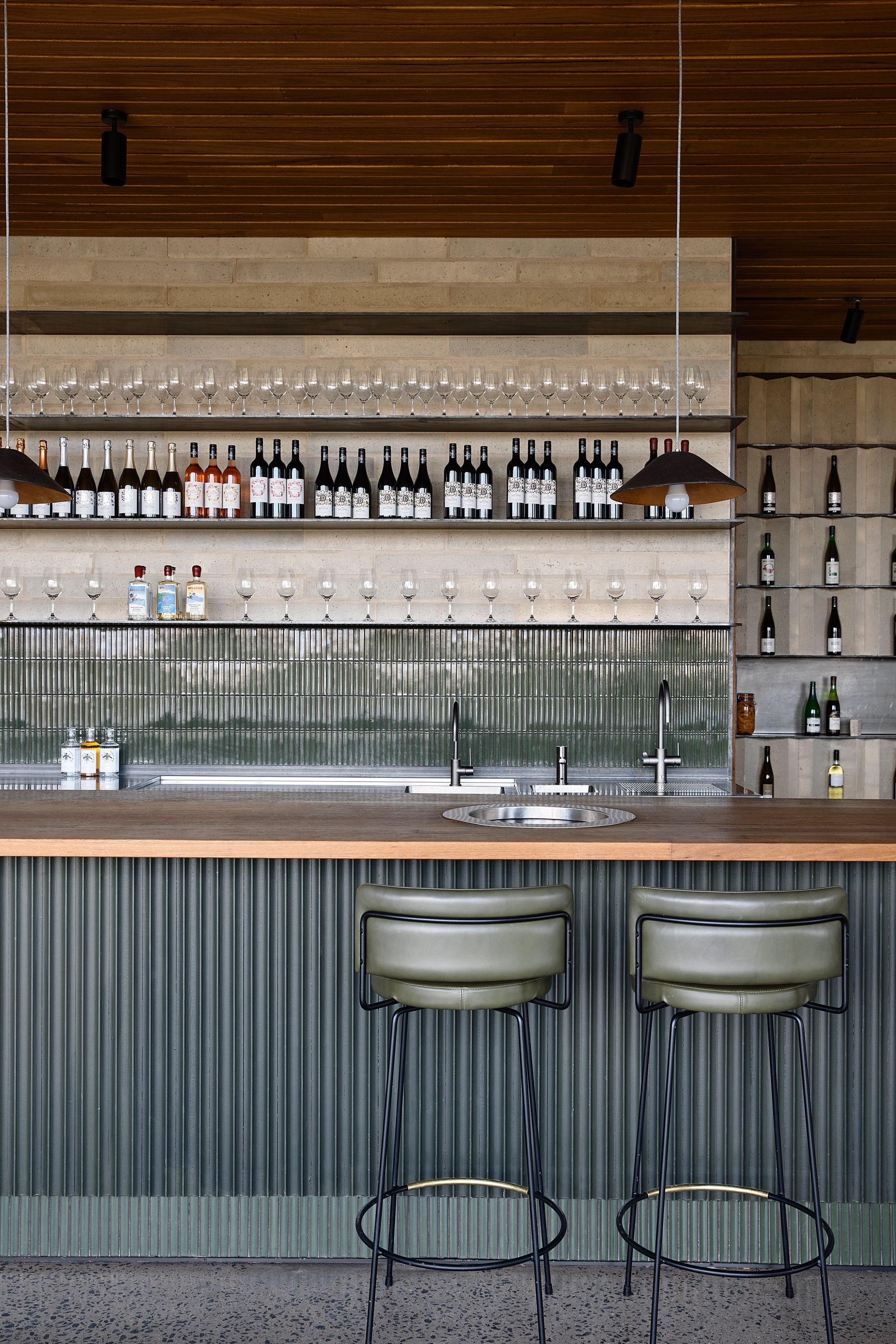 Delatite Cellar Door by Lucy Clemenger Architects. Detailed veiw of bar for wine tasting. 