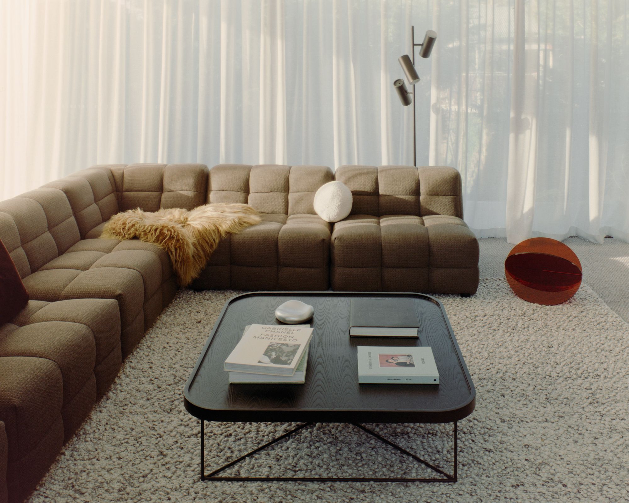 Retreat House by Aych Architects. Living room view, featuring muted natural tone. 