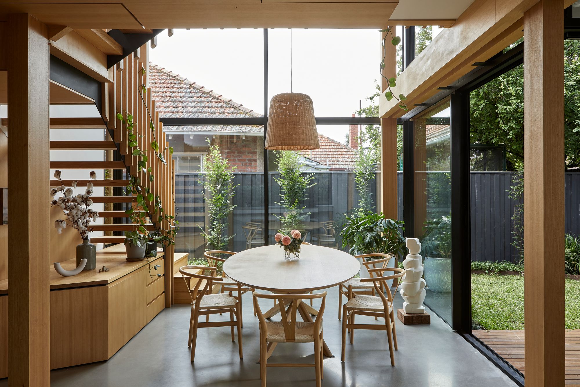 Timber Lantern House by mcmahon and nerlich. Dining area with large windows opening out to Garden. 