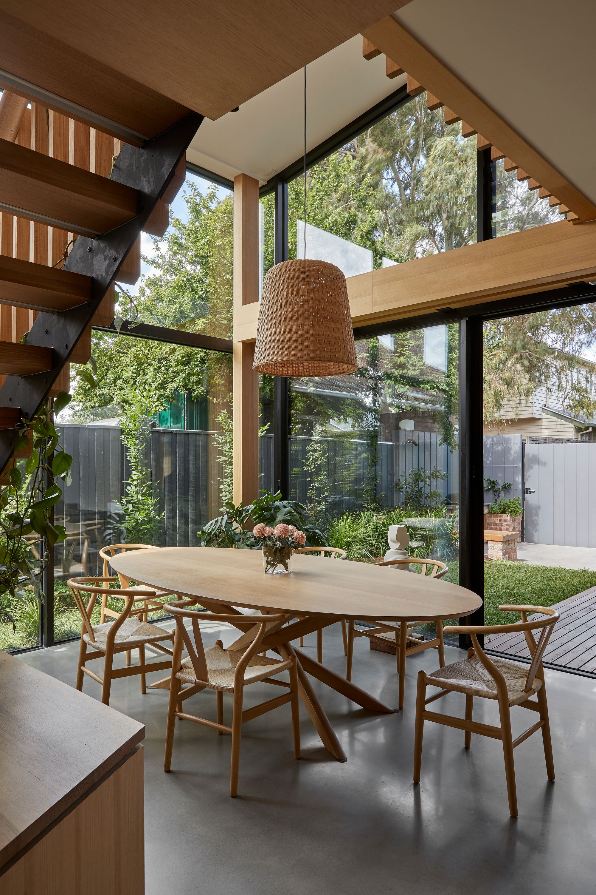 Timber Lantern House by mcmahon and nerlich.  Dining area, windows and doors opening out to garden. 