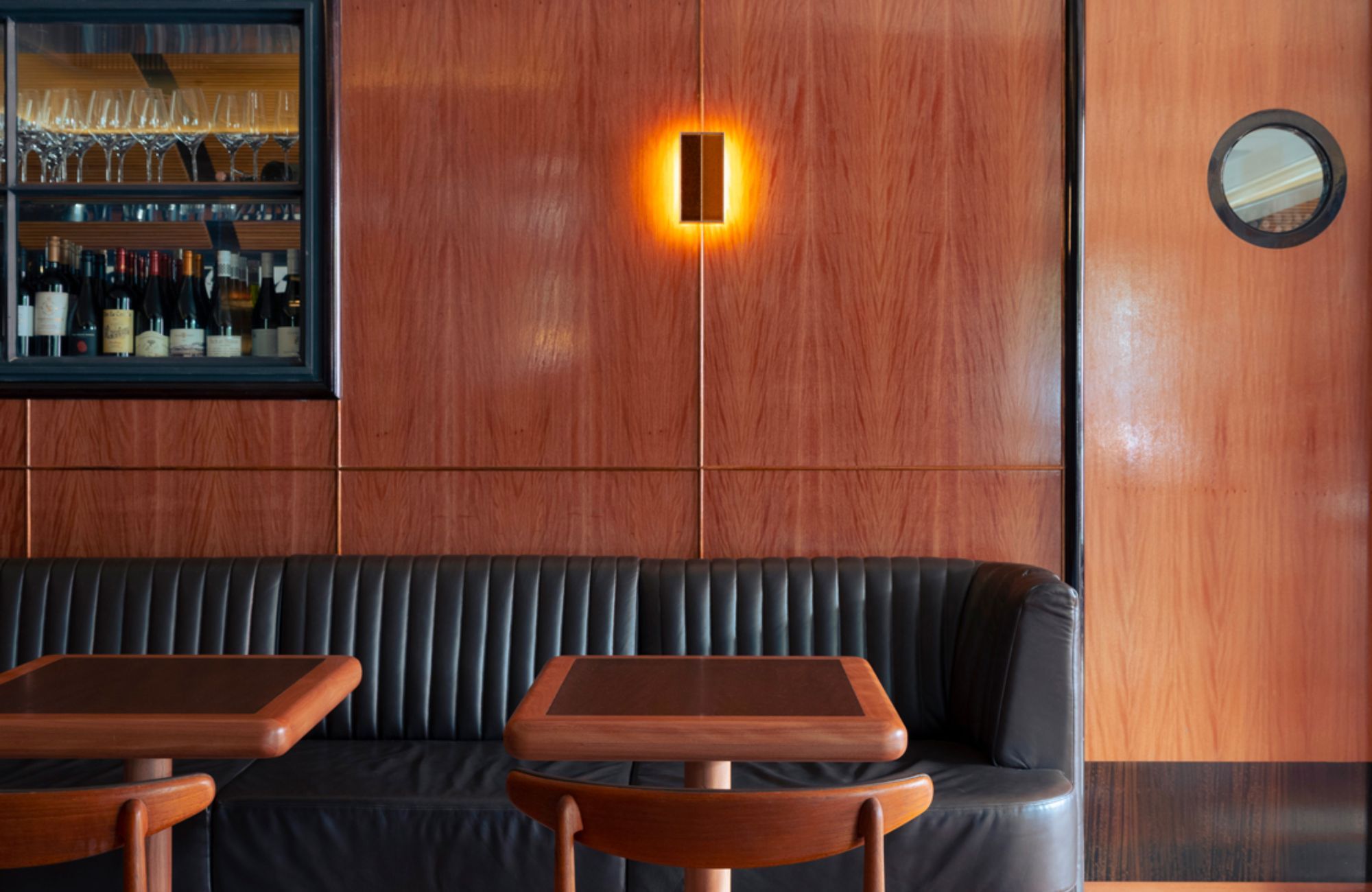 Woollahra Hotel by Richards Stanisich showing timber lined wall and leather booth seat