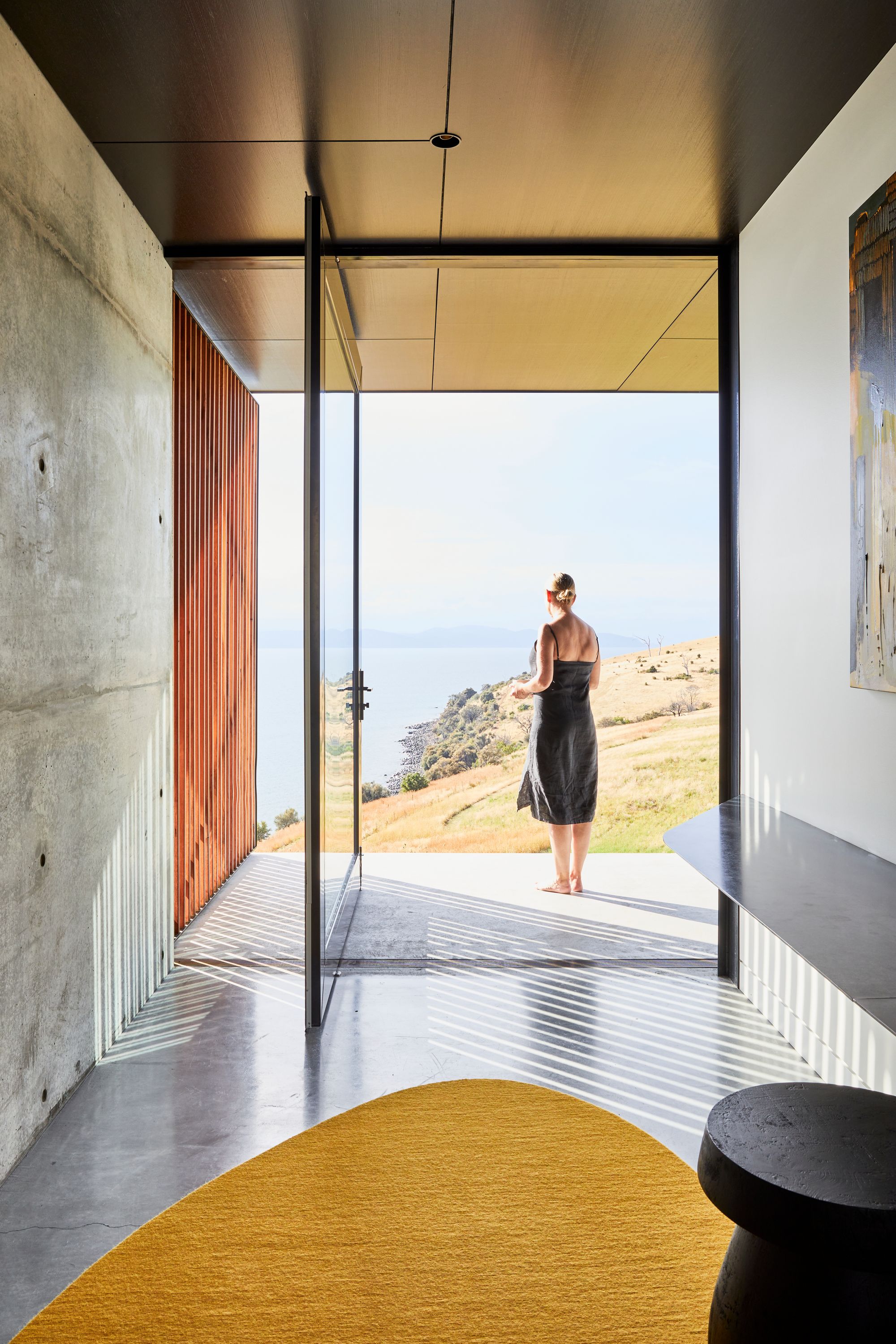 The Point Tasmania. View form entryway, door opening out to surrounding landscape