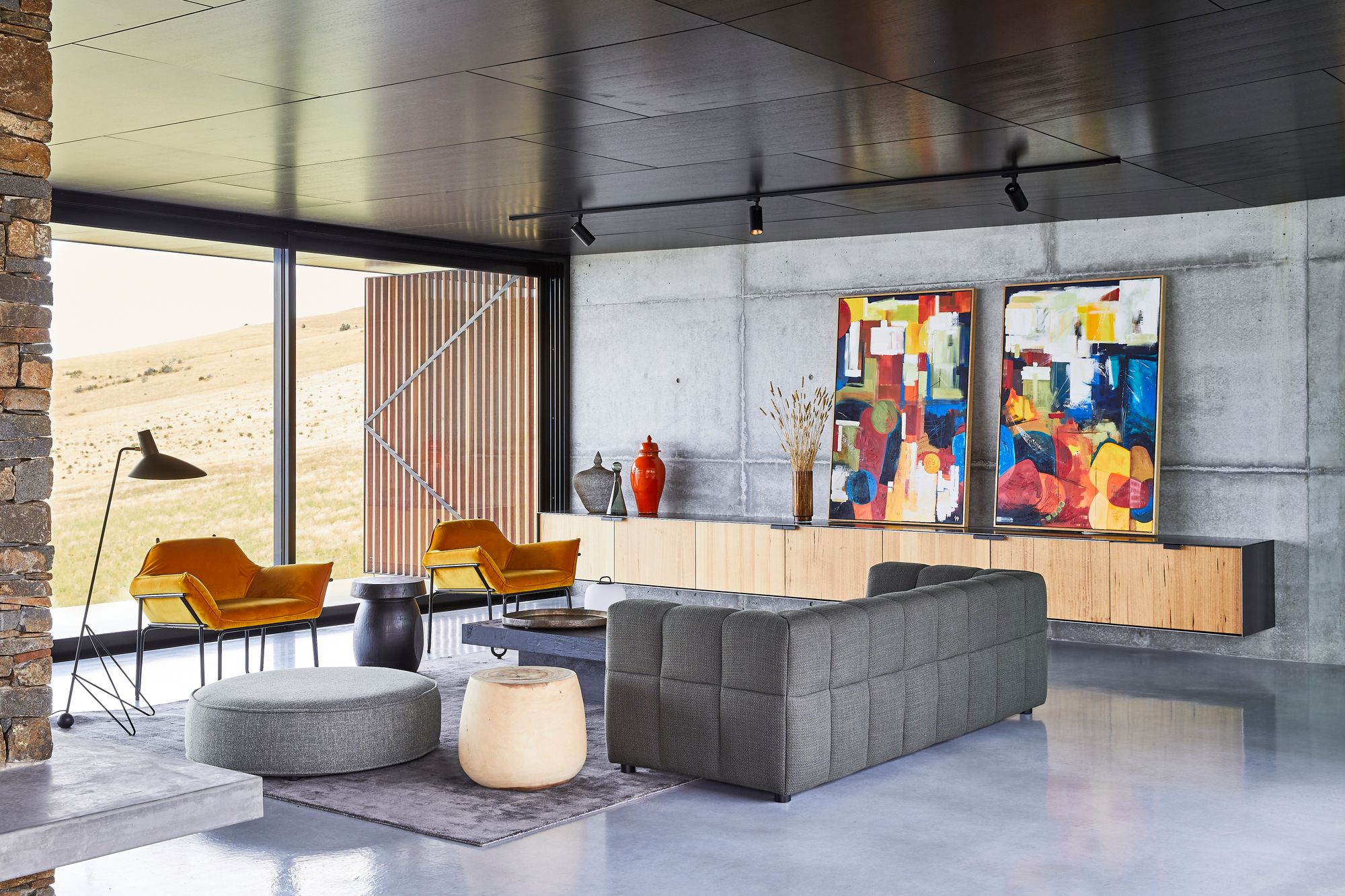 The Point Tasmania. Lounge room featuring colourful pops of colour againts natural materal form. 
