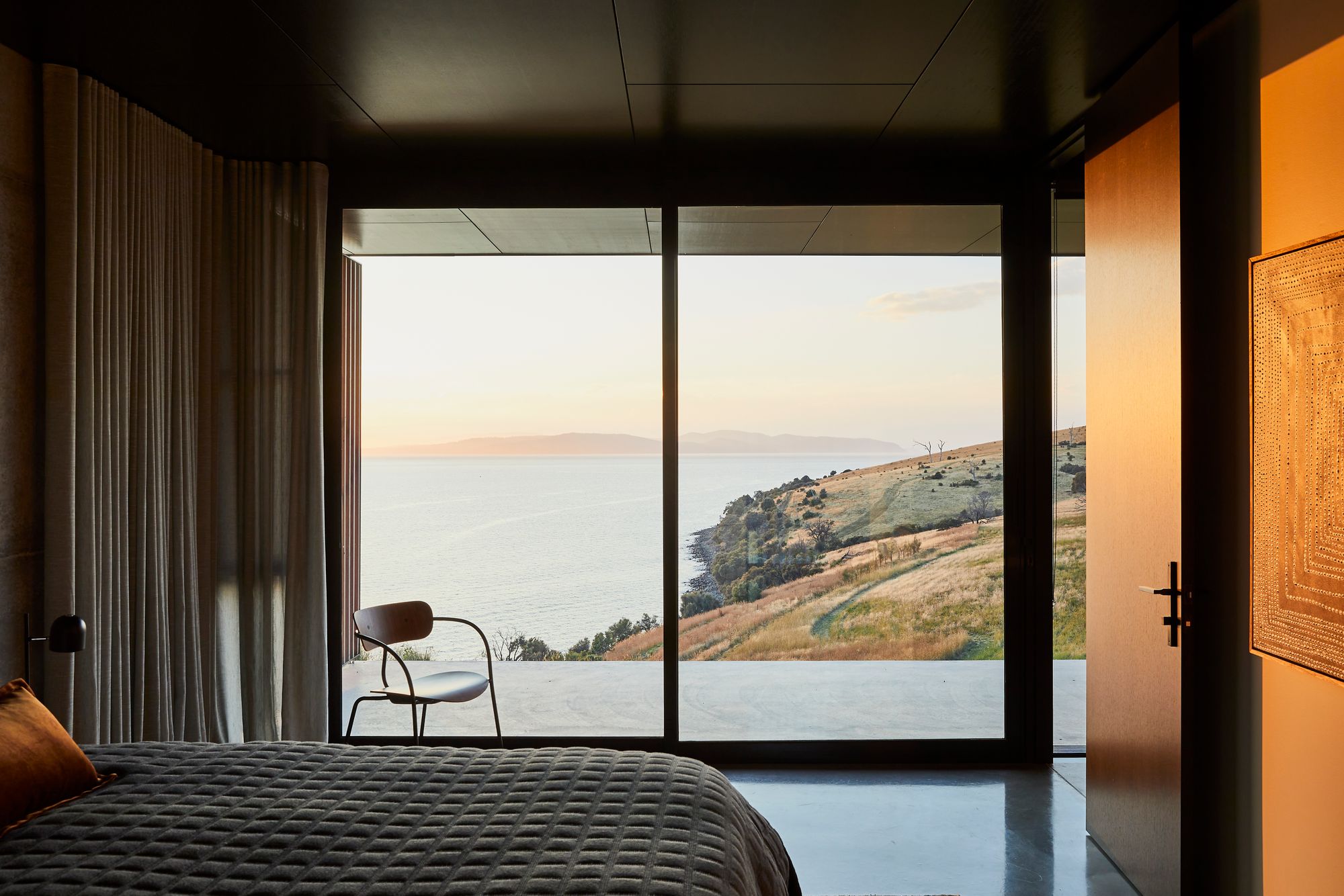 The Point Tasmania. Main master bedroom view out to surrounding landscape. 