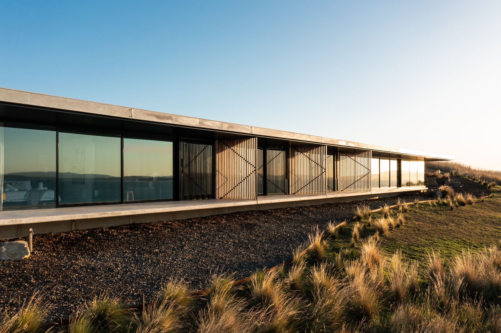 The Point Tasmania. Front glass facade, blending in with surrounding landscape.