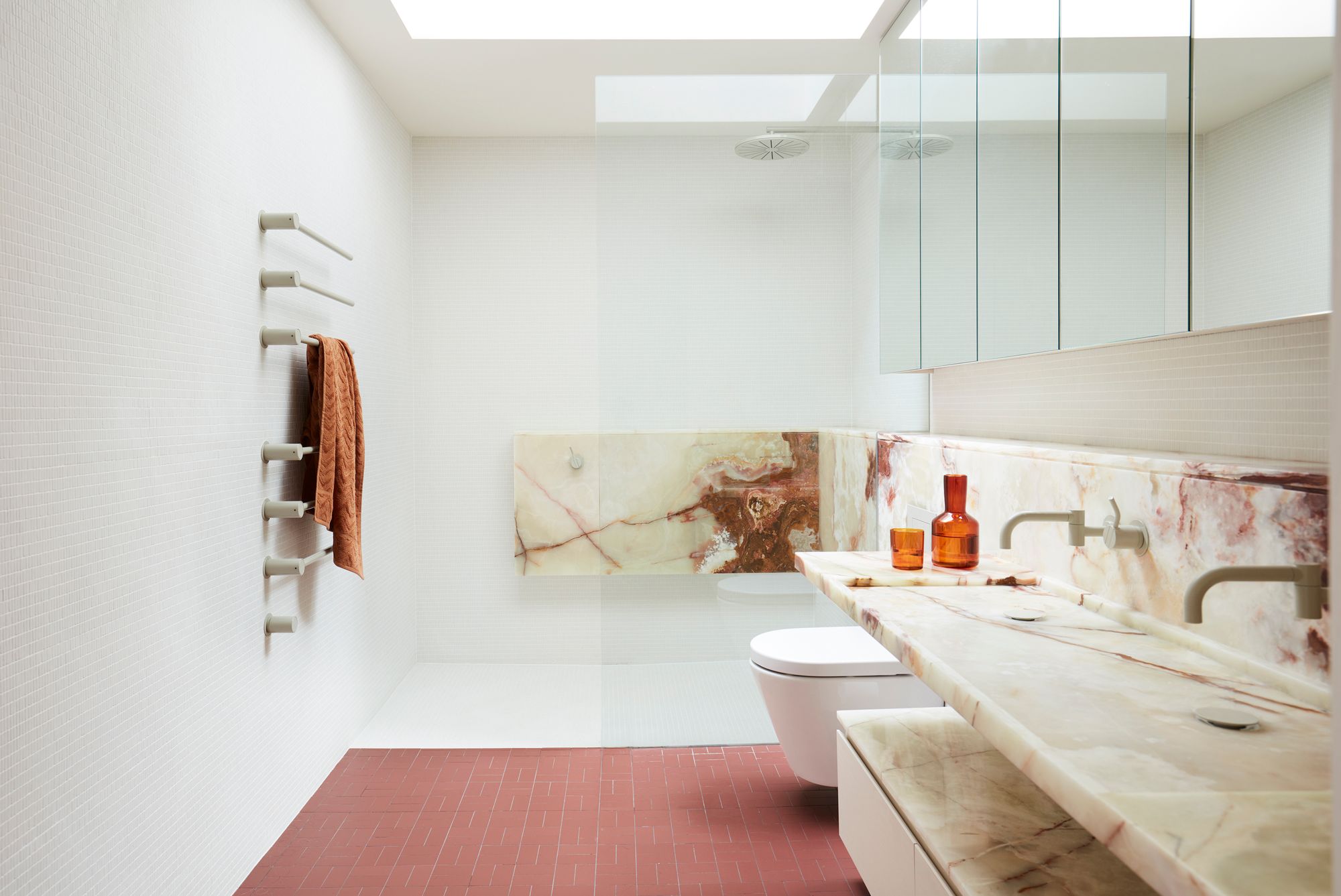 Dream Weaver by YSG Studio. Main bathroom with feature calcatta marble and pink tiling. 
