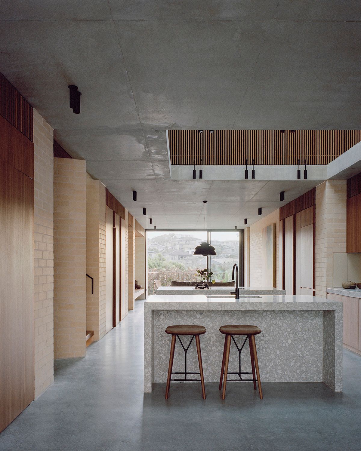 Bronte House by Tribe Studio Architects showing internal view of kitchen space with a void over